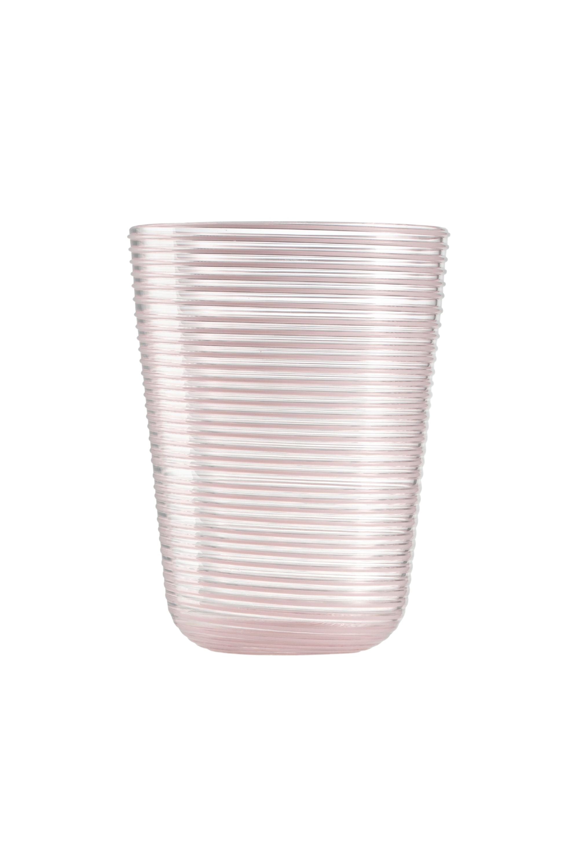 Transparent glass embossed with mauve glass thread spiraling up the cup.