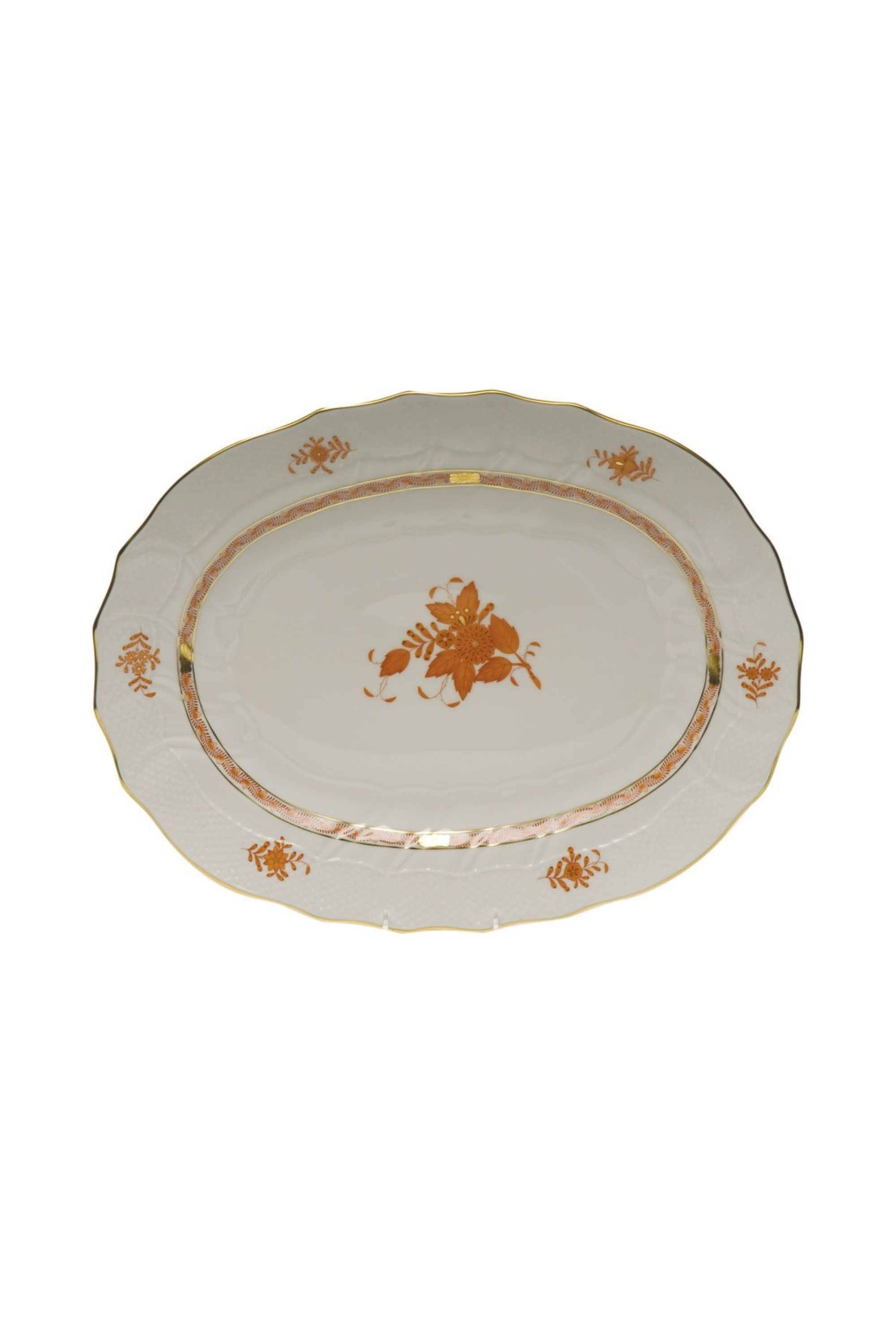 Chinese Bouquet is one of Herend’s most popular Oriental designs from the 1930s. Each piece is hand painted on white porcelain including 24k accents in rust.