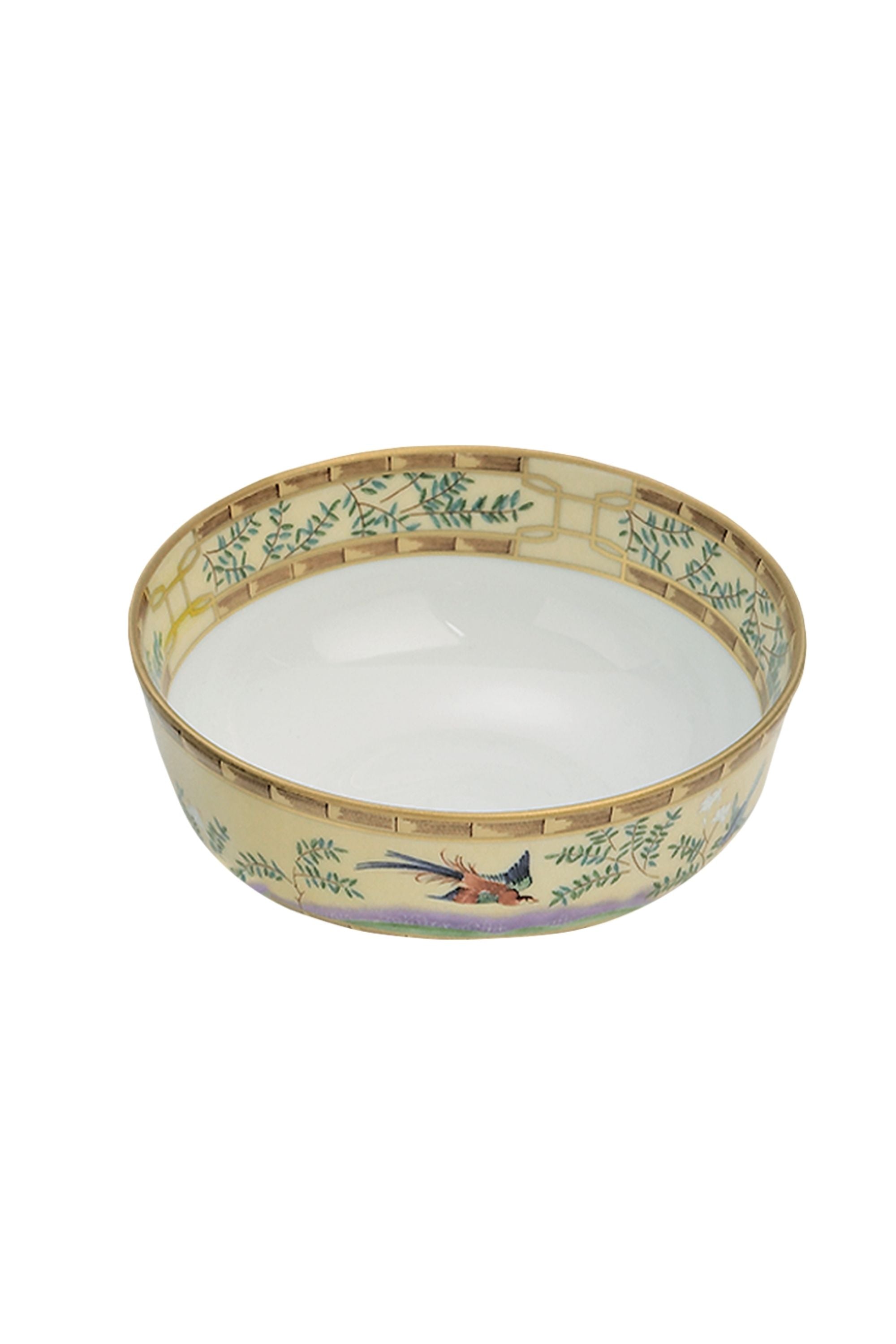 Chinese dinnerware. The decoration incorporates blossoming trees, hanging baskets of flowers, and exotic birds.