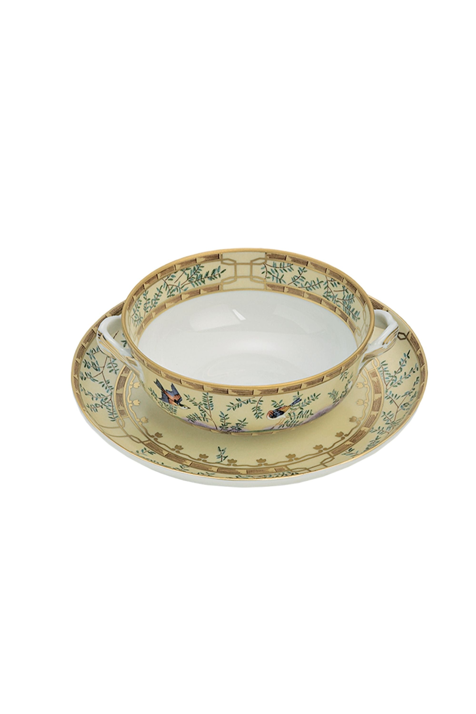Chinese dinnerware. The decoration incorporates blossoming trees, hanging baskets of flowers, and exotic birds.