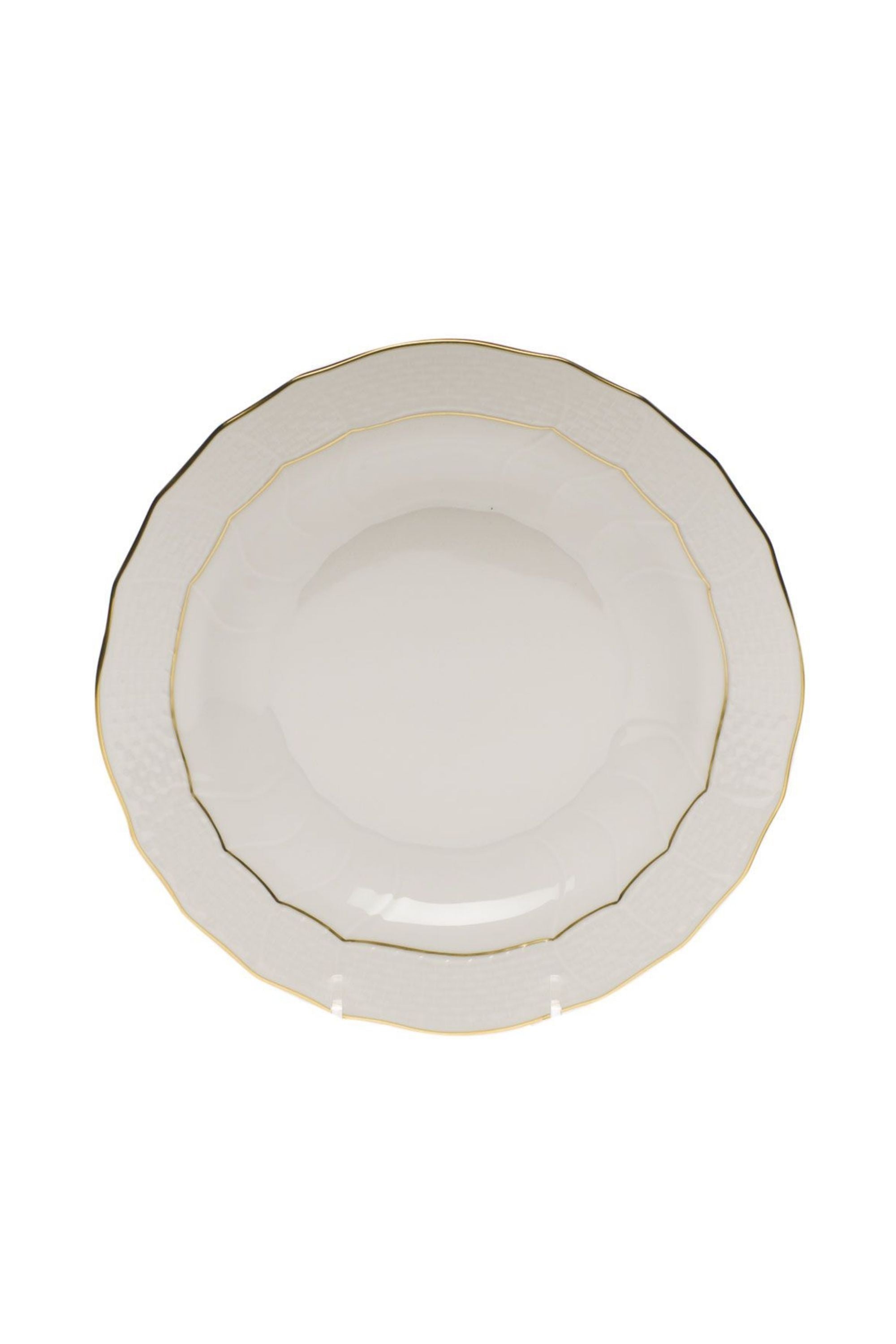 Dinnerware that is white with gold edge.