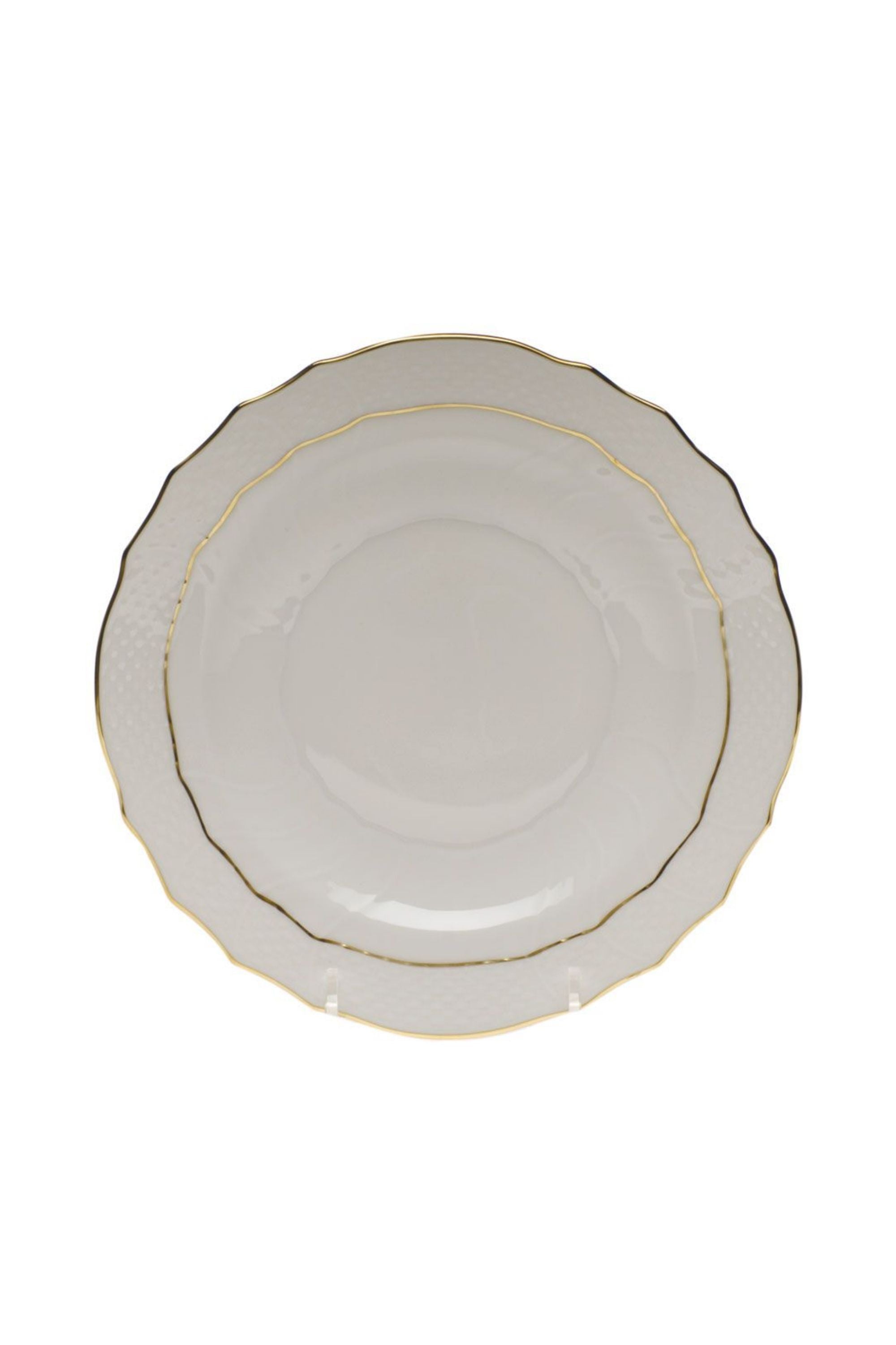 Dinnerware that is white with gold edge.