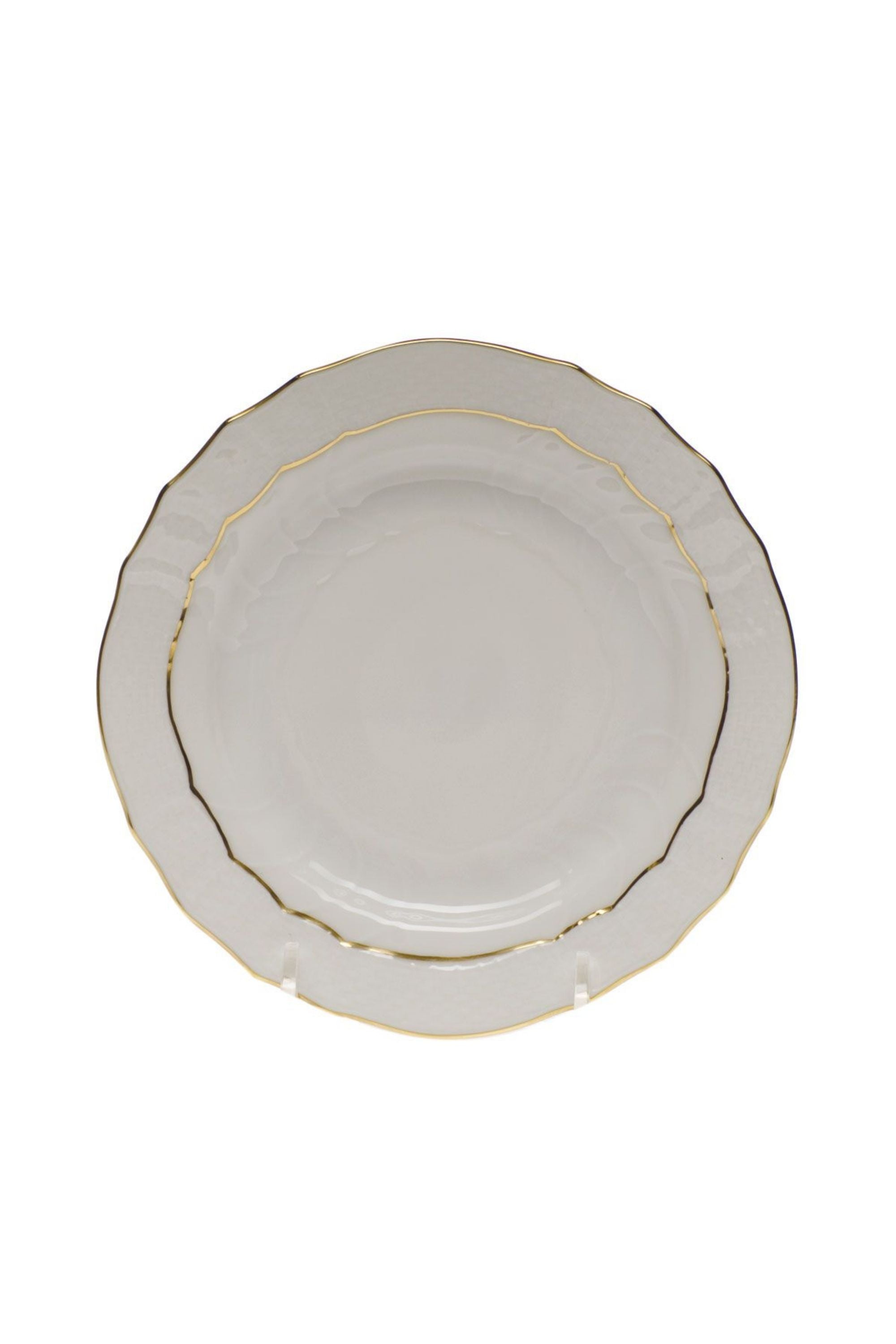 Dinnerware that is white with gold edge.