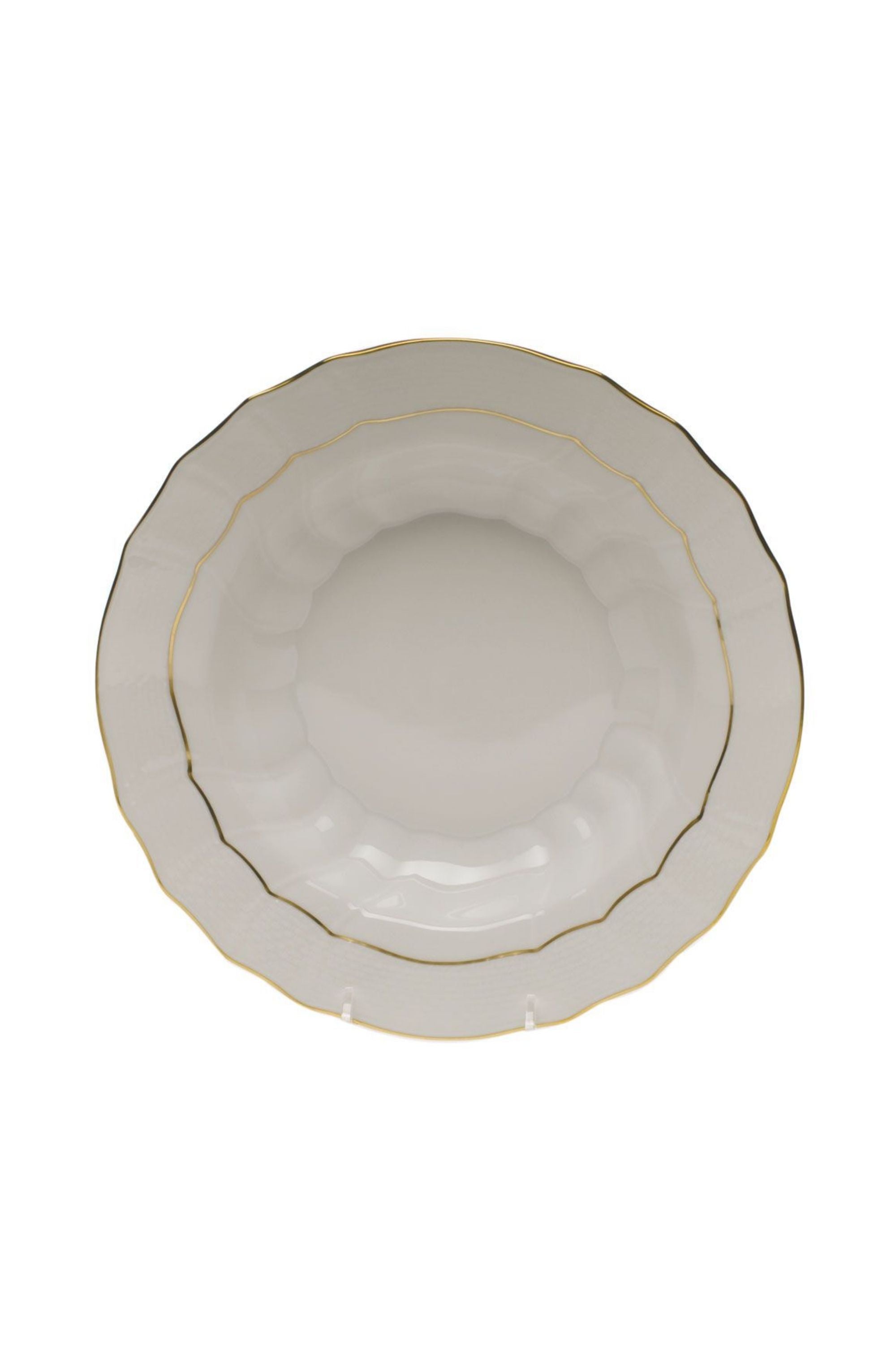 Dinnerware that is white with gold edge.