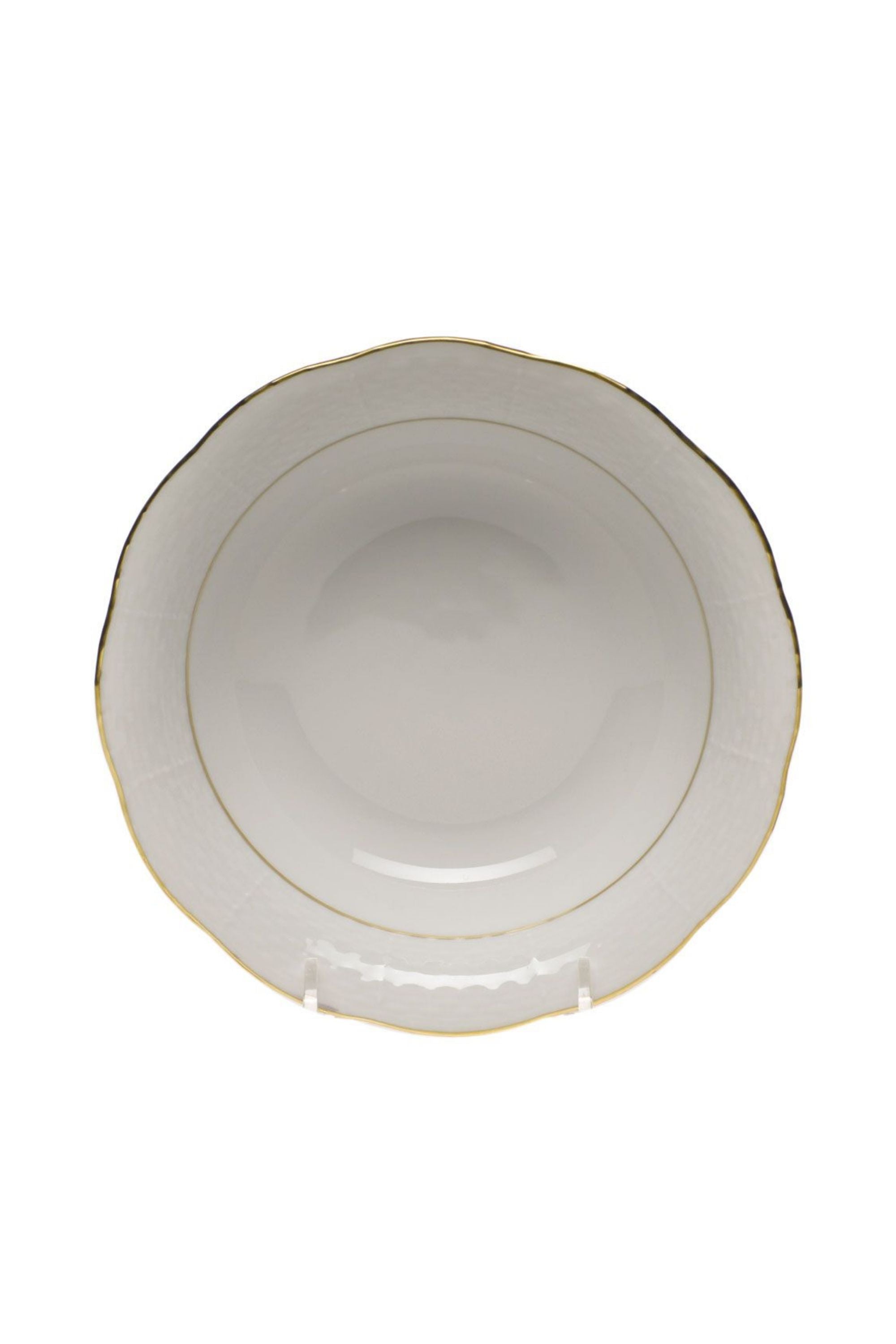 Dinnerware that is white with gold edge.