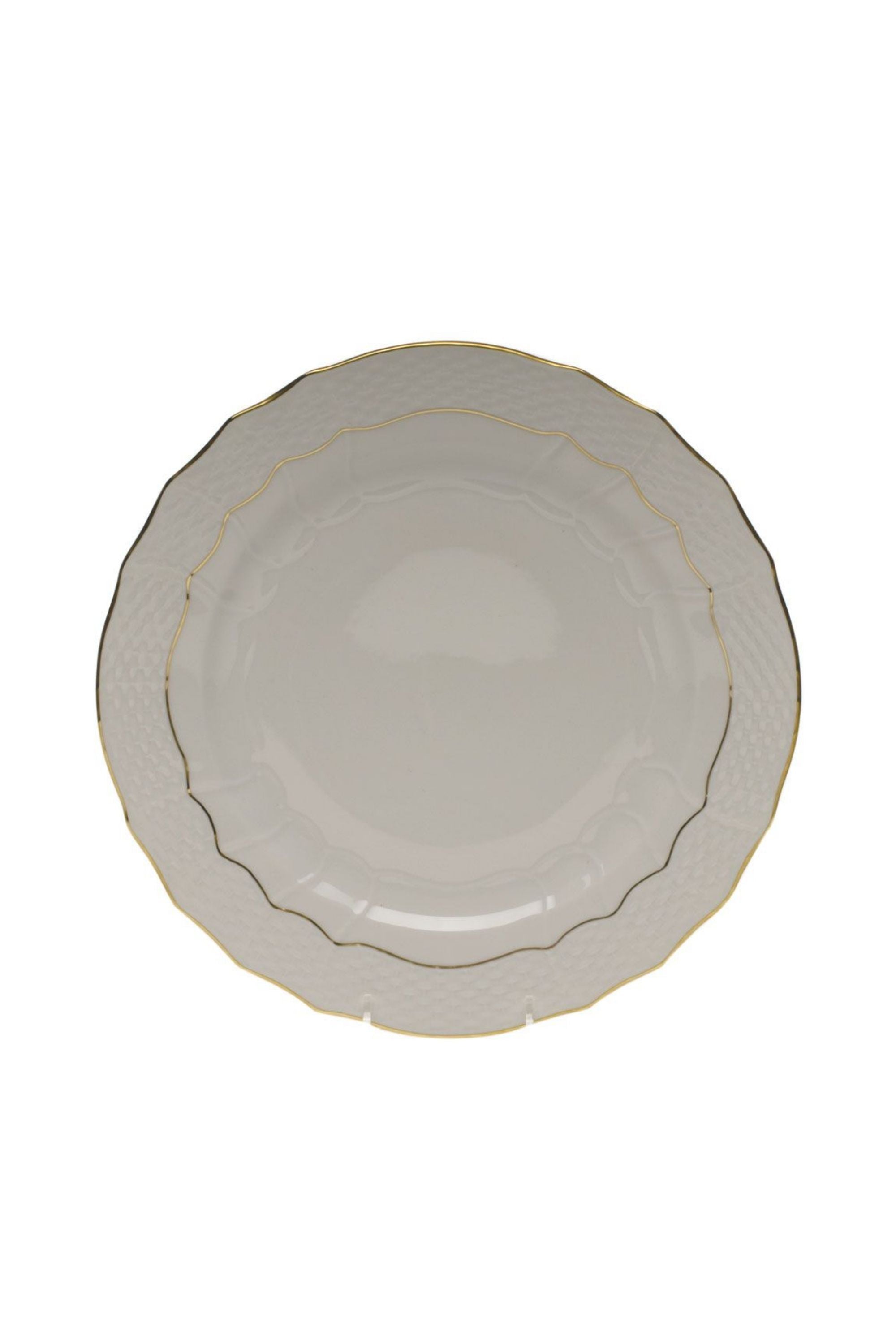 Dinnerware that is white with gold edge.