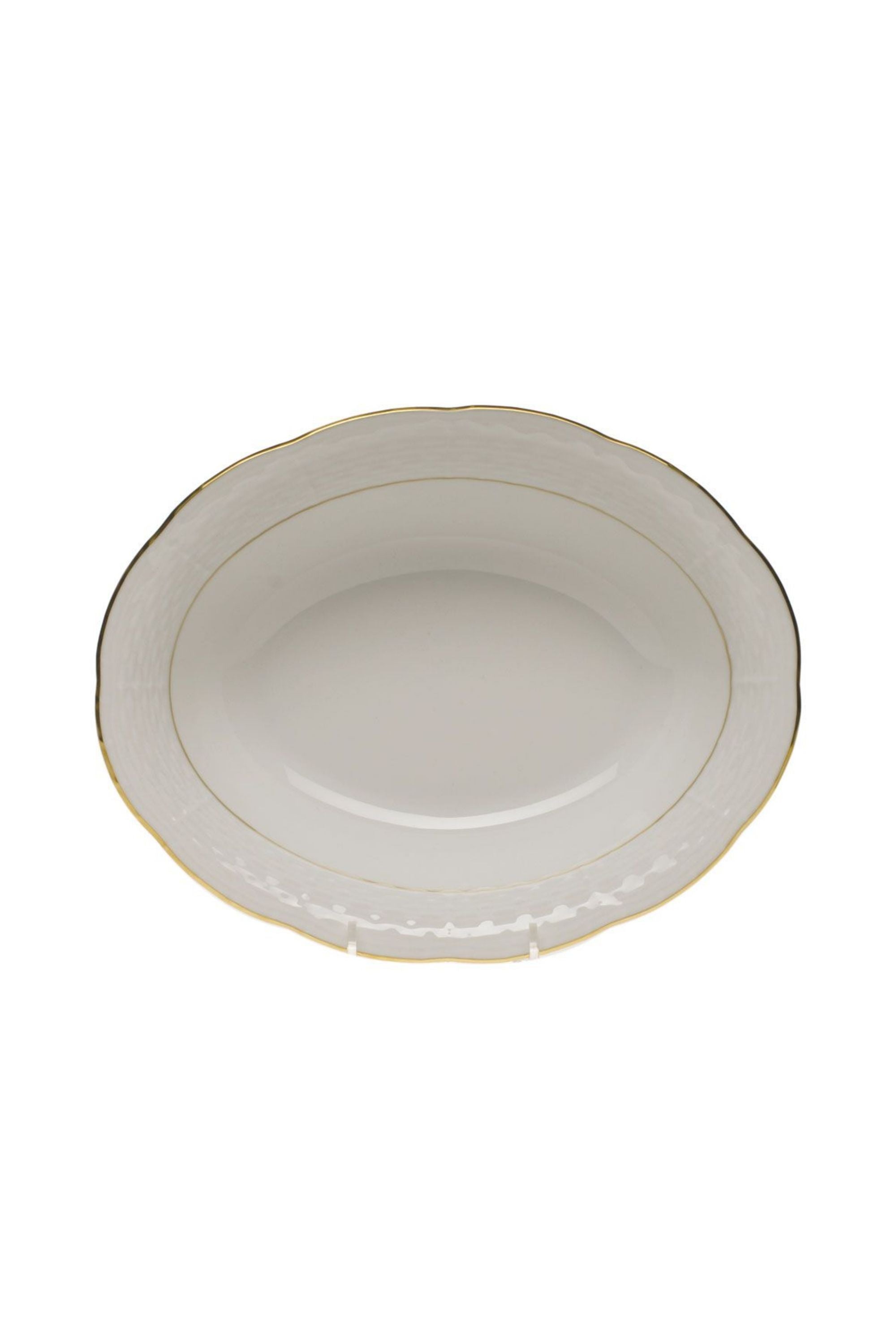 Serving dishes that is white with gold edge.