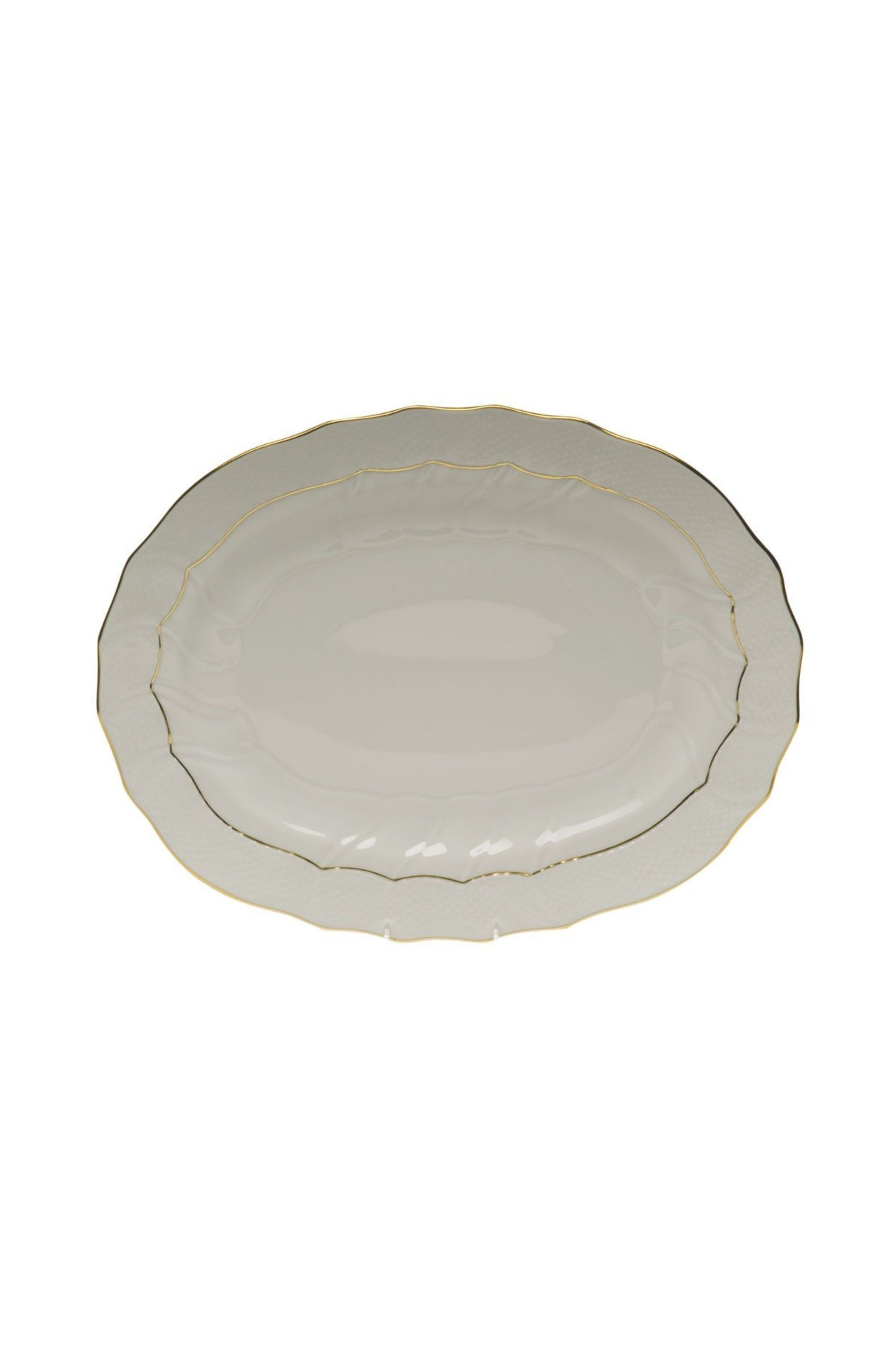 Serving dishes that is white with gold edge.