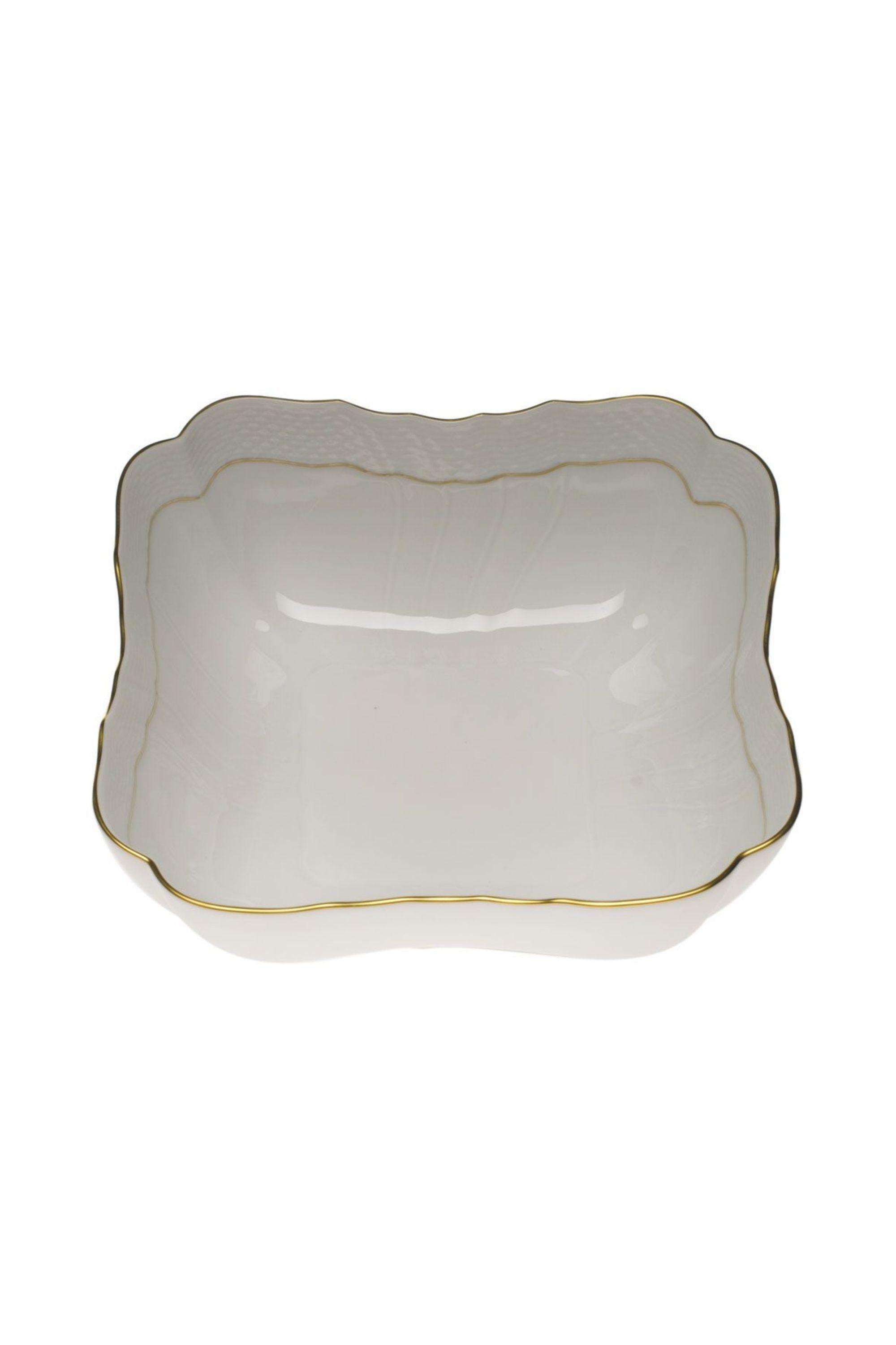 Serving dishes that is white with gold edge.