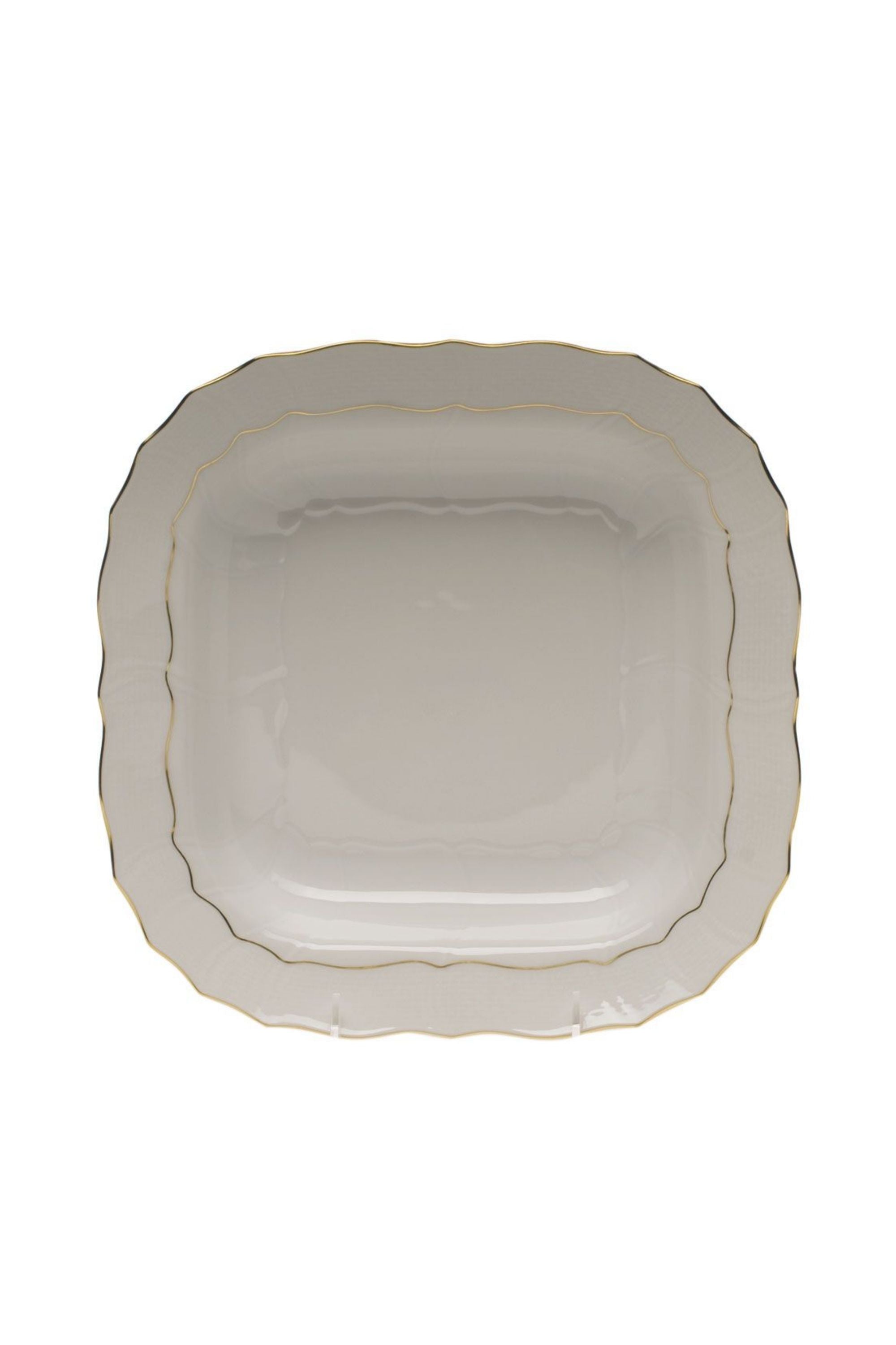 Serving dishes that is white with gold edge.