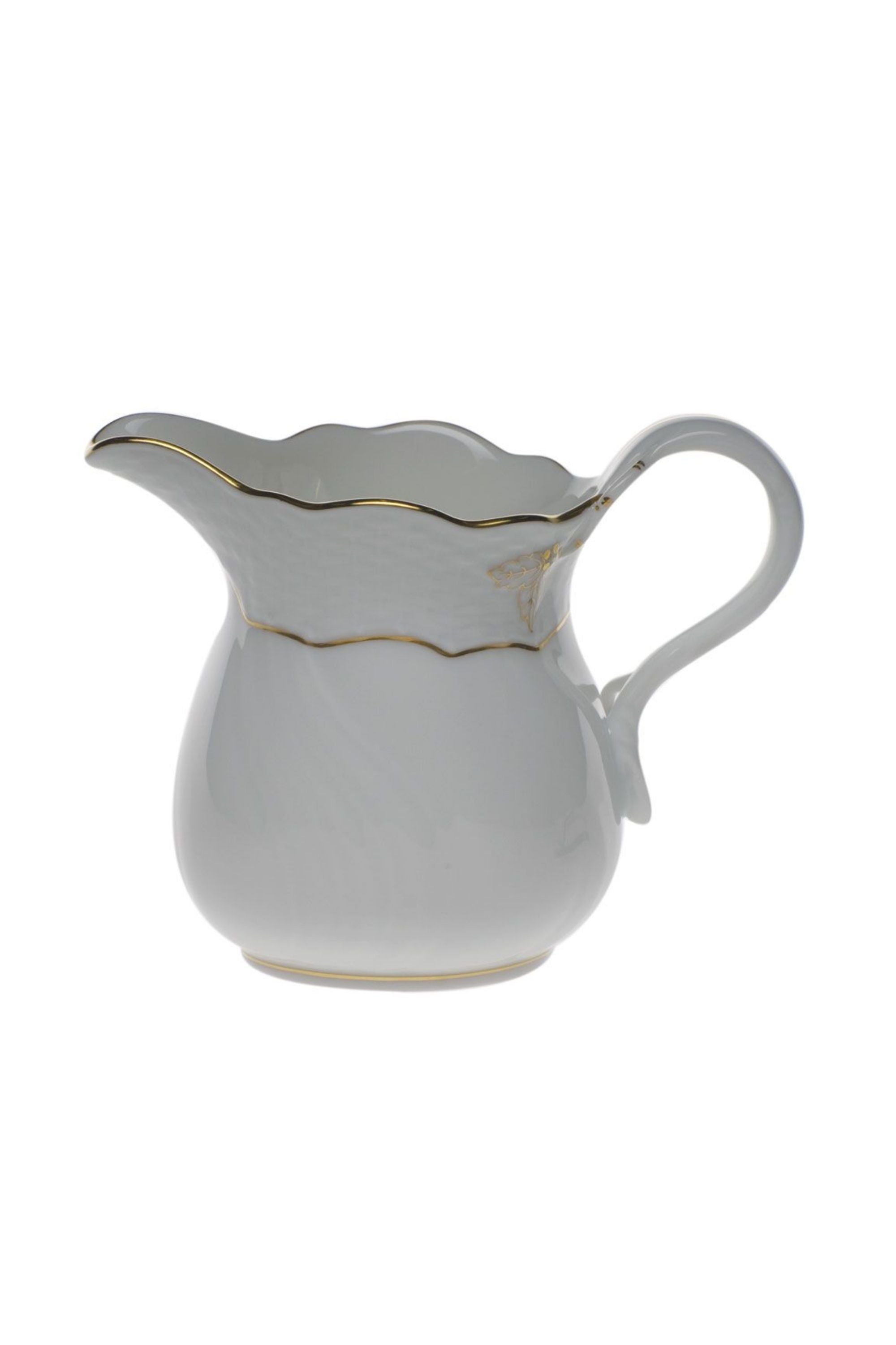 Tea service that is white with gold edge.