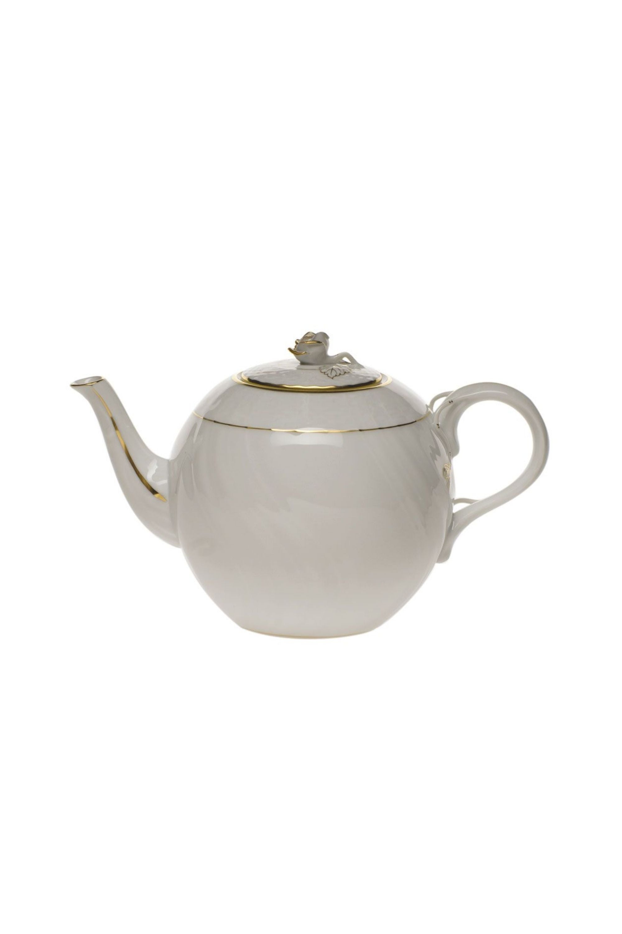 Tea service that is white with gold edge.