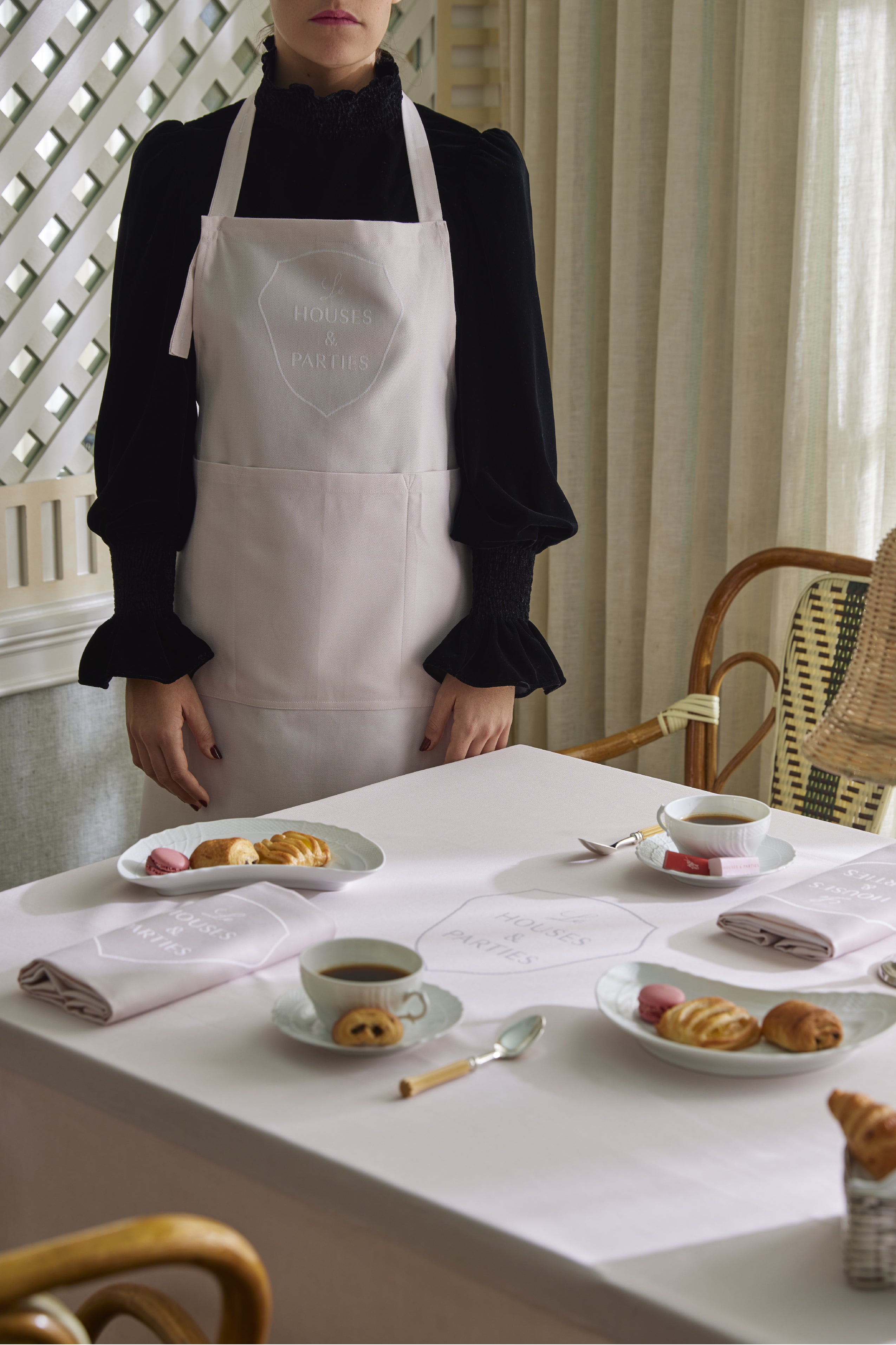 Apron that is 100% commercial grade cotton with a jacquard woven Le Houses and Parties logo.