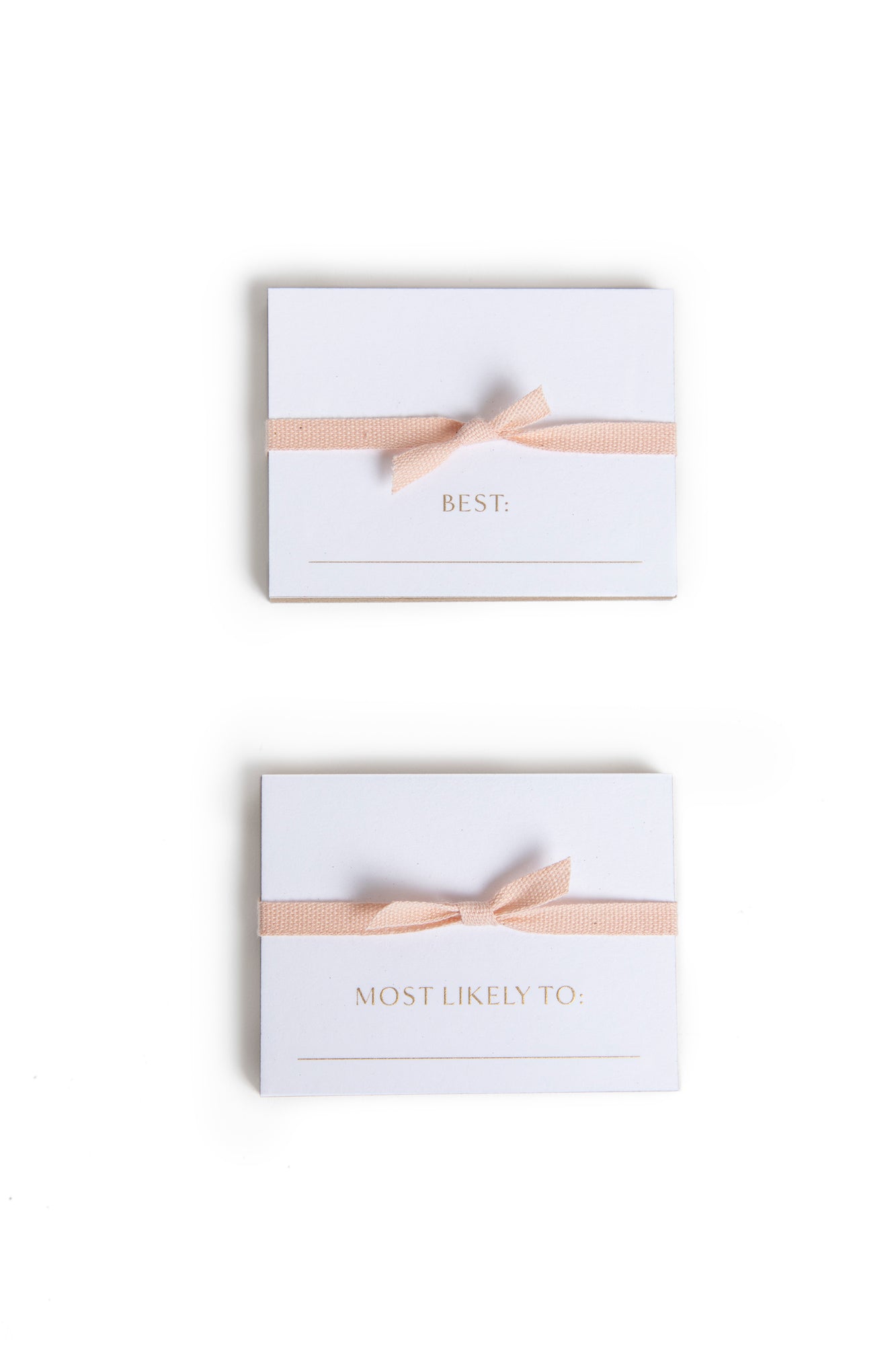 Engraved superlative place cards in gold ink for extra luxe.