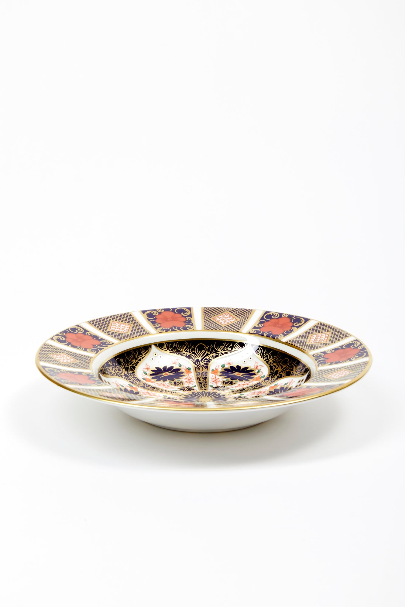Rim soup bowl for soup, salad, and dessert. Handmade in England by Royal Crown Derby. Iron red, cobalt blue, and 22 karat gold.