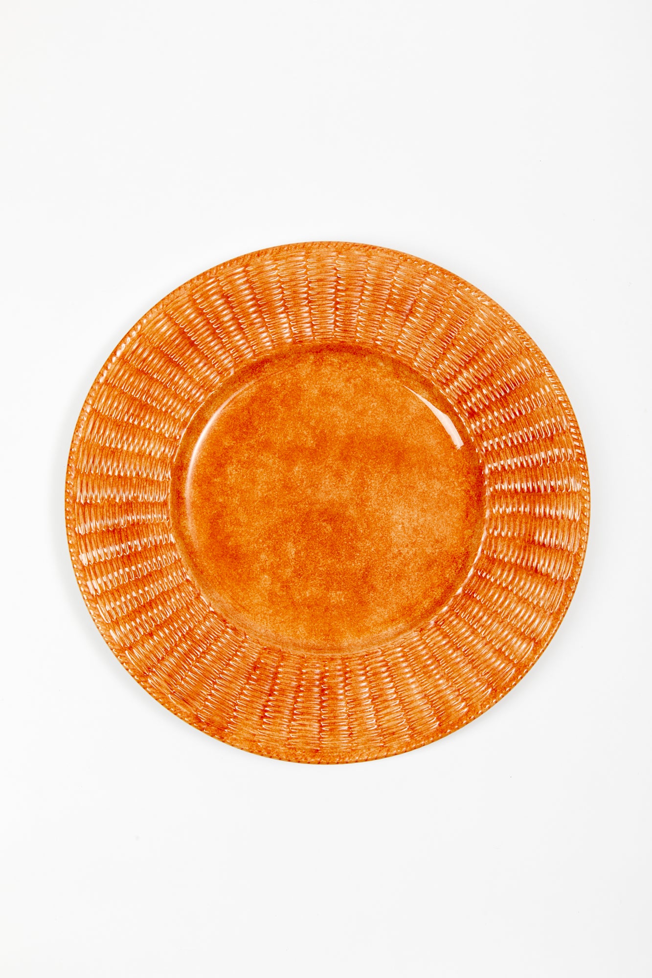 Orange ceramic wicker service plate.