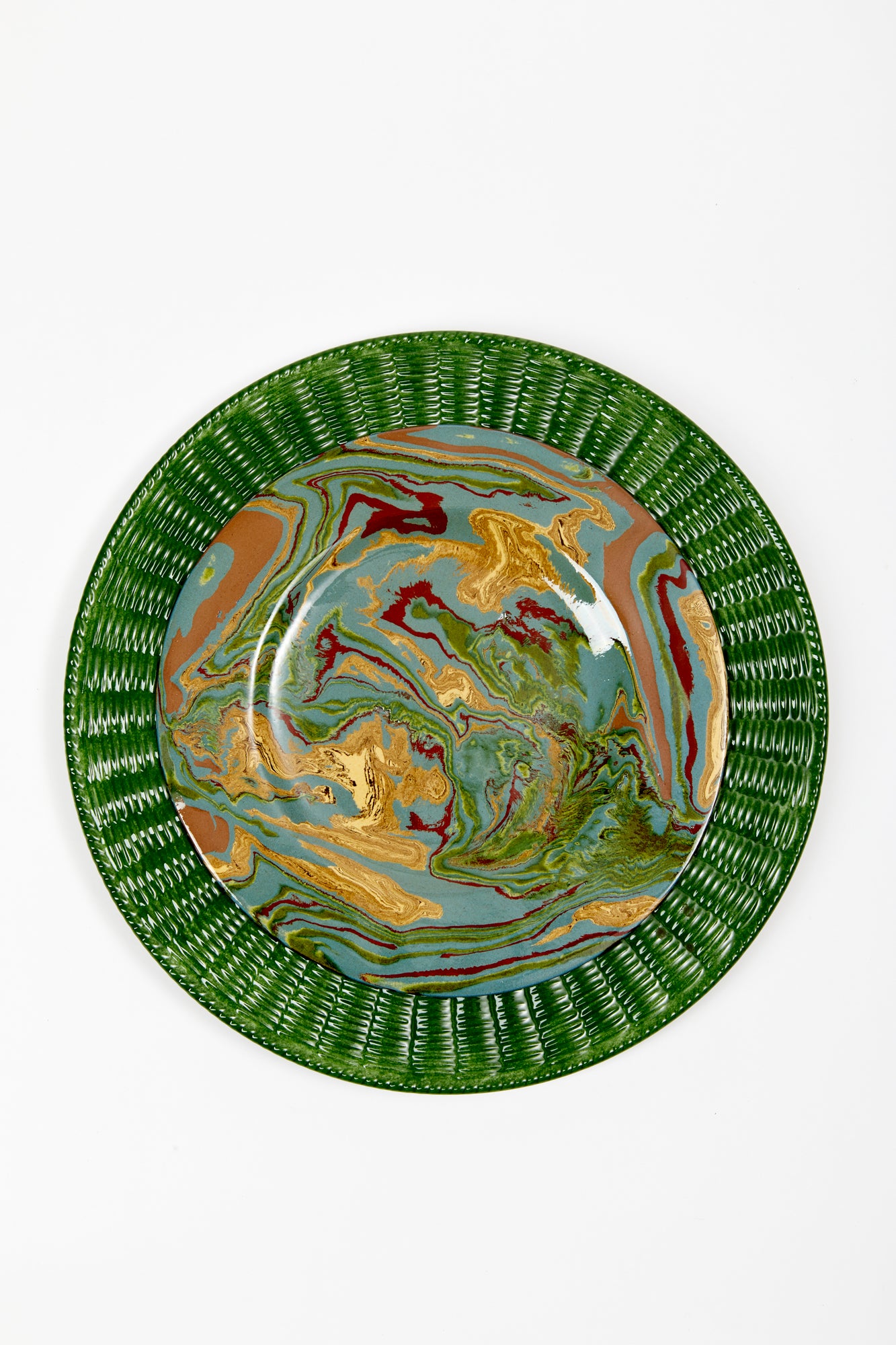 Green ceramic service plate trimmed in a wicker basket pattern.
