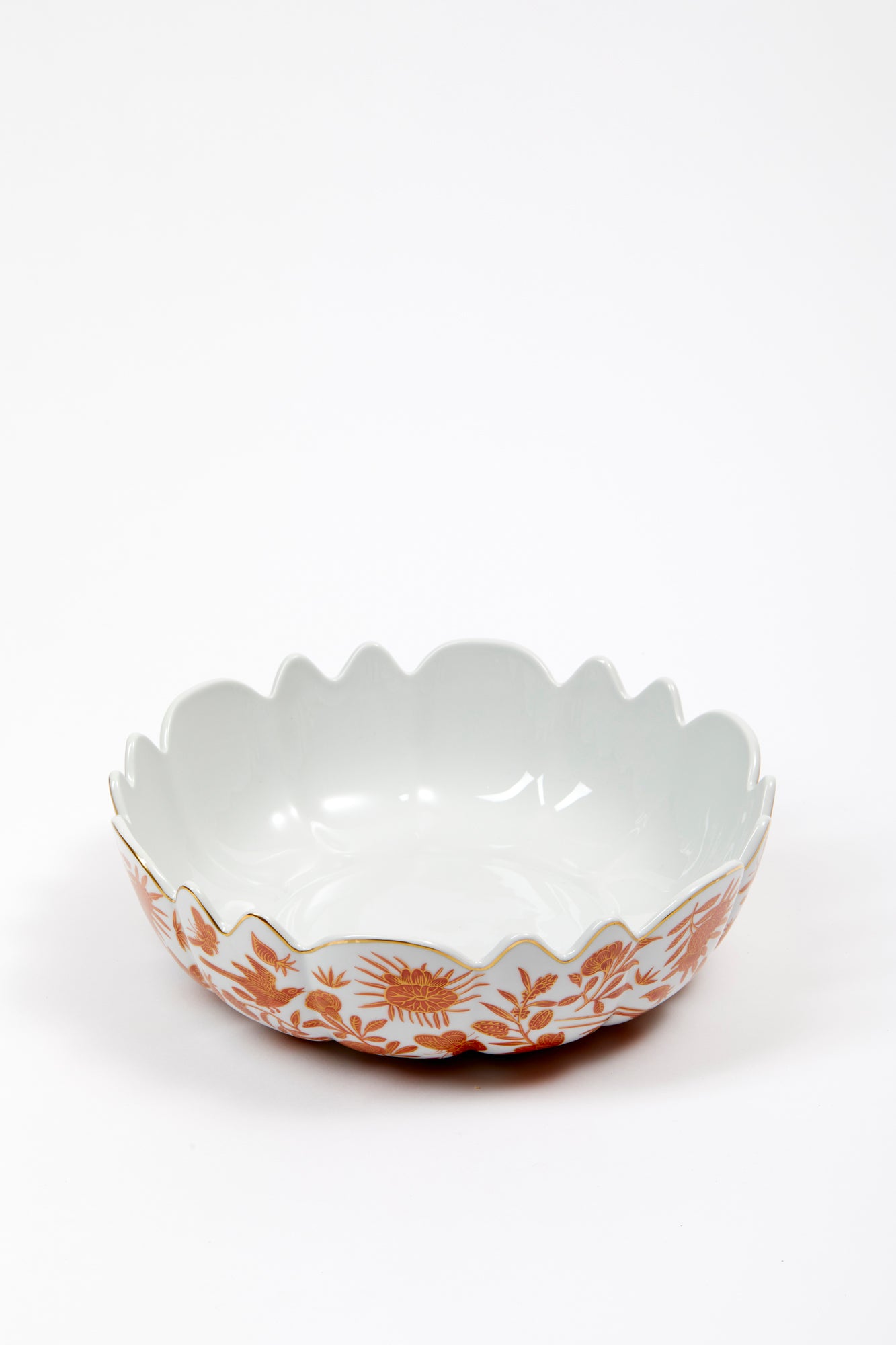 Sacred birds in orange print. Five piece place setting includes dinner plate, dessert plate, bread & butter plate and teacup with saucer.