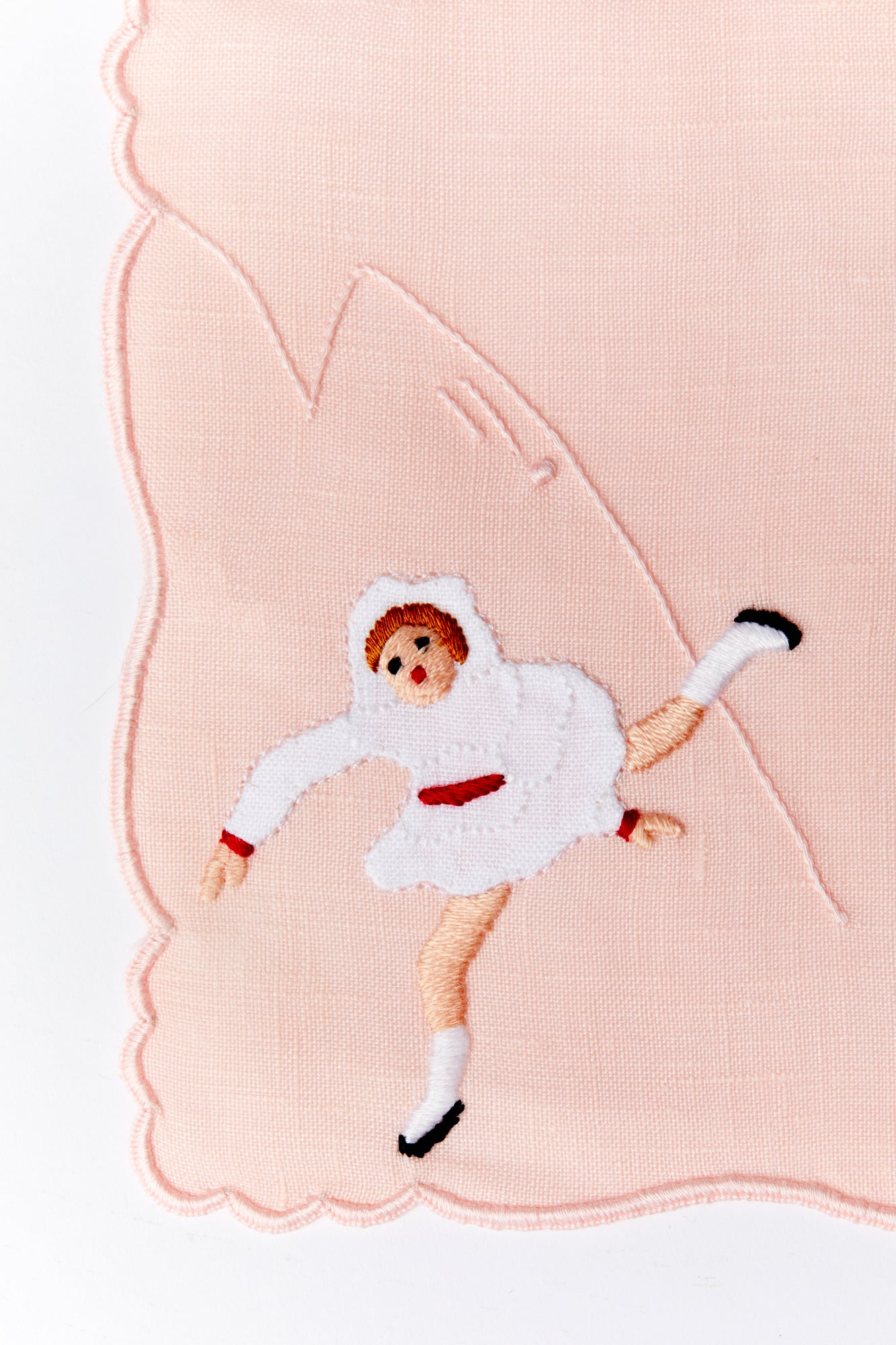 A set of 4 cocktail napkins with appliqué ice skaters made in Madeira, Portugal