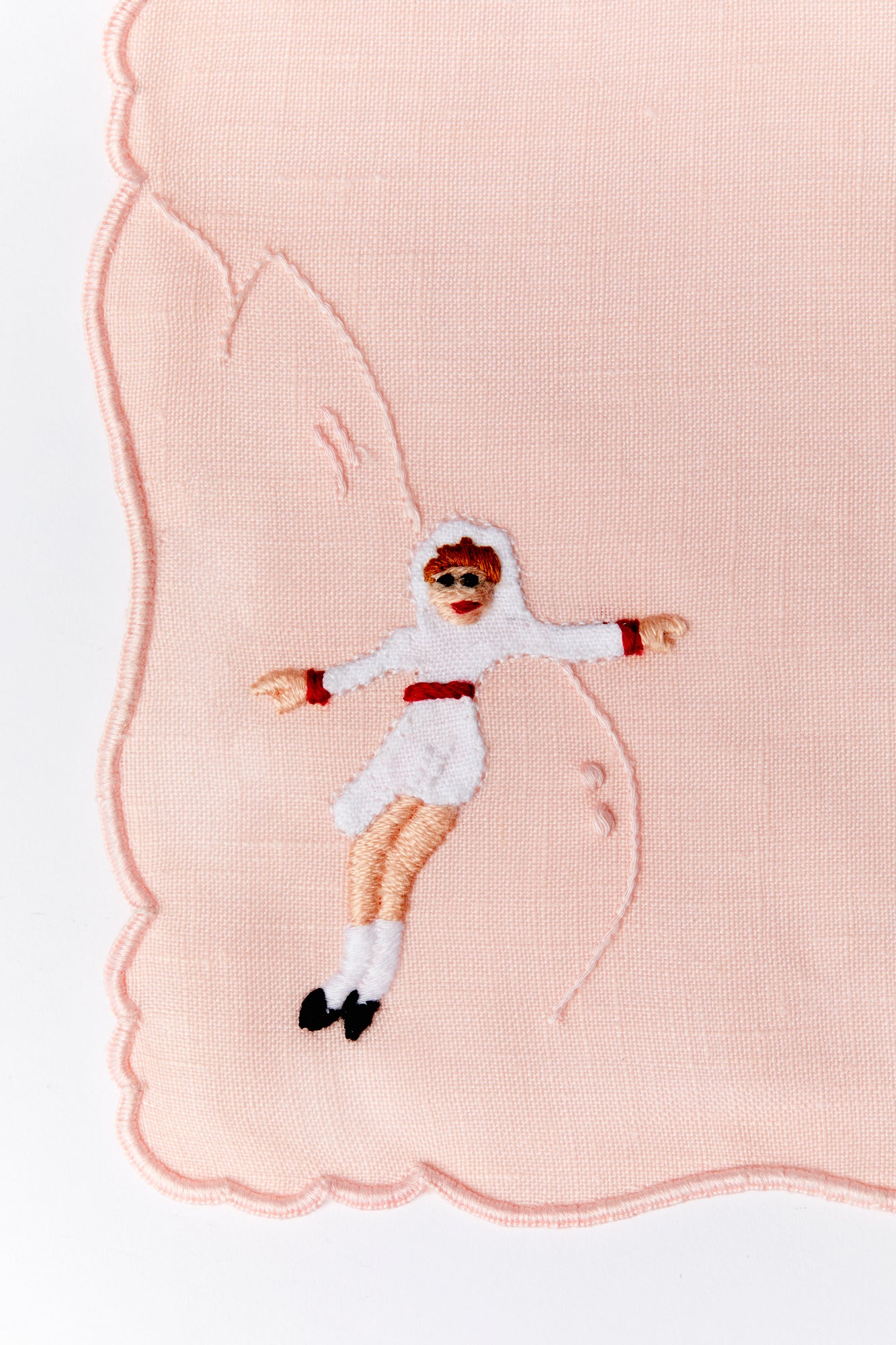 A set of 4 cocktail napkins with appliqué ice skaters made in Madeira, Portugal