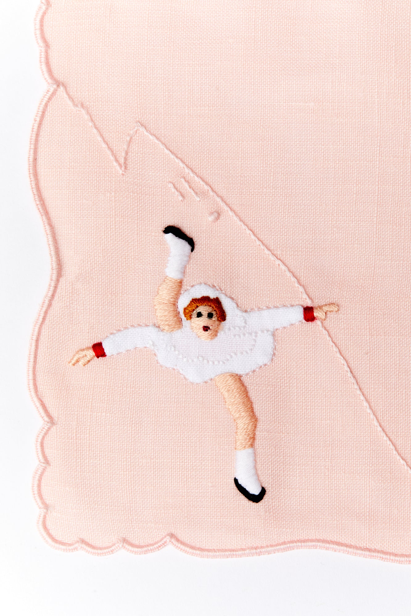 A set of 4 cocktail napkins with appliqué ice skaters made in Madeira, Portugal