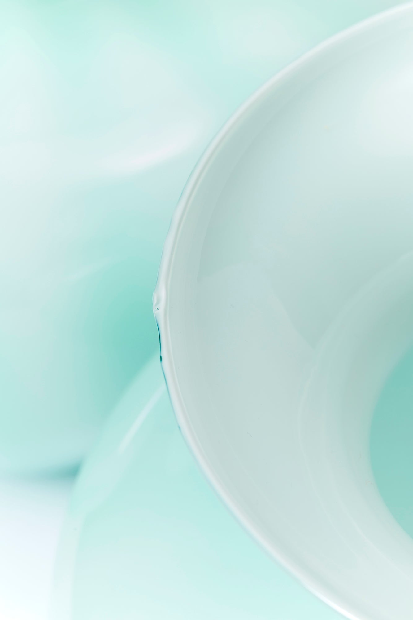 Pair of lipped vases striated with the most delicate tonal melon stripes.