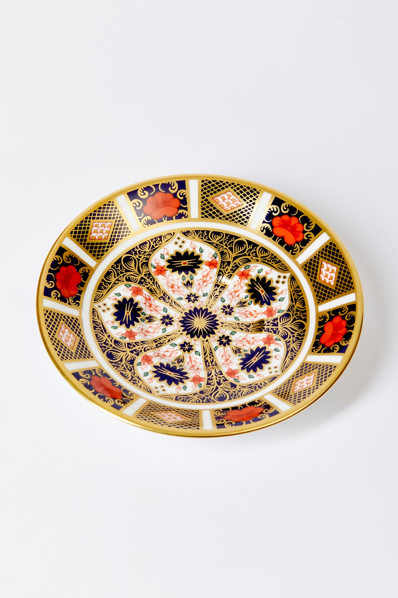 Handmade in England by Royal Crown Derby. The distinctive 1128 Old Imari pattern dates back to 1882. Iron red, cobalt blue, and 22 karat gold.