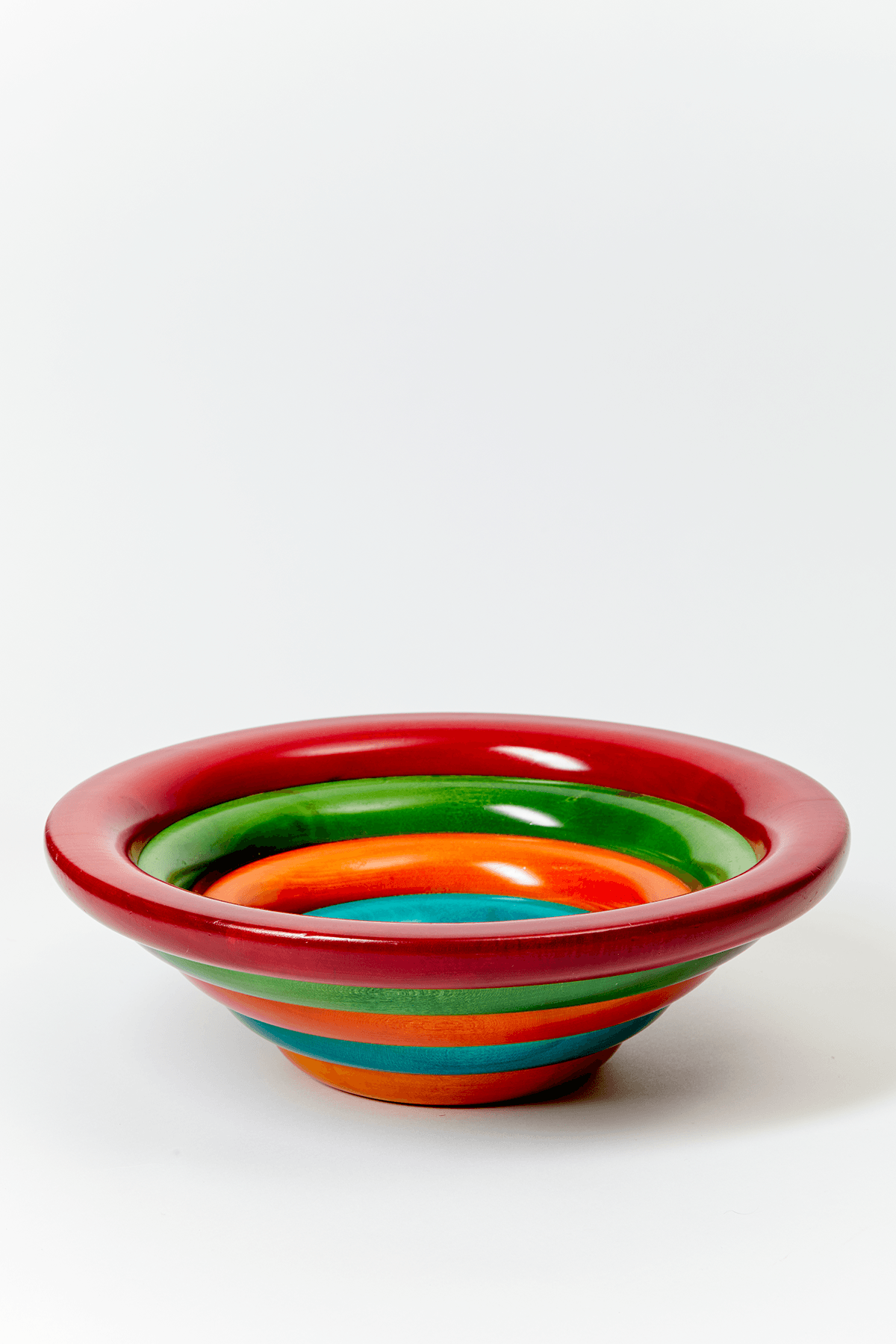 Sculptural and colorful wood serving bowl designed by Manzoni Pietro and made in Bergamo, Italy.