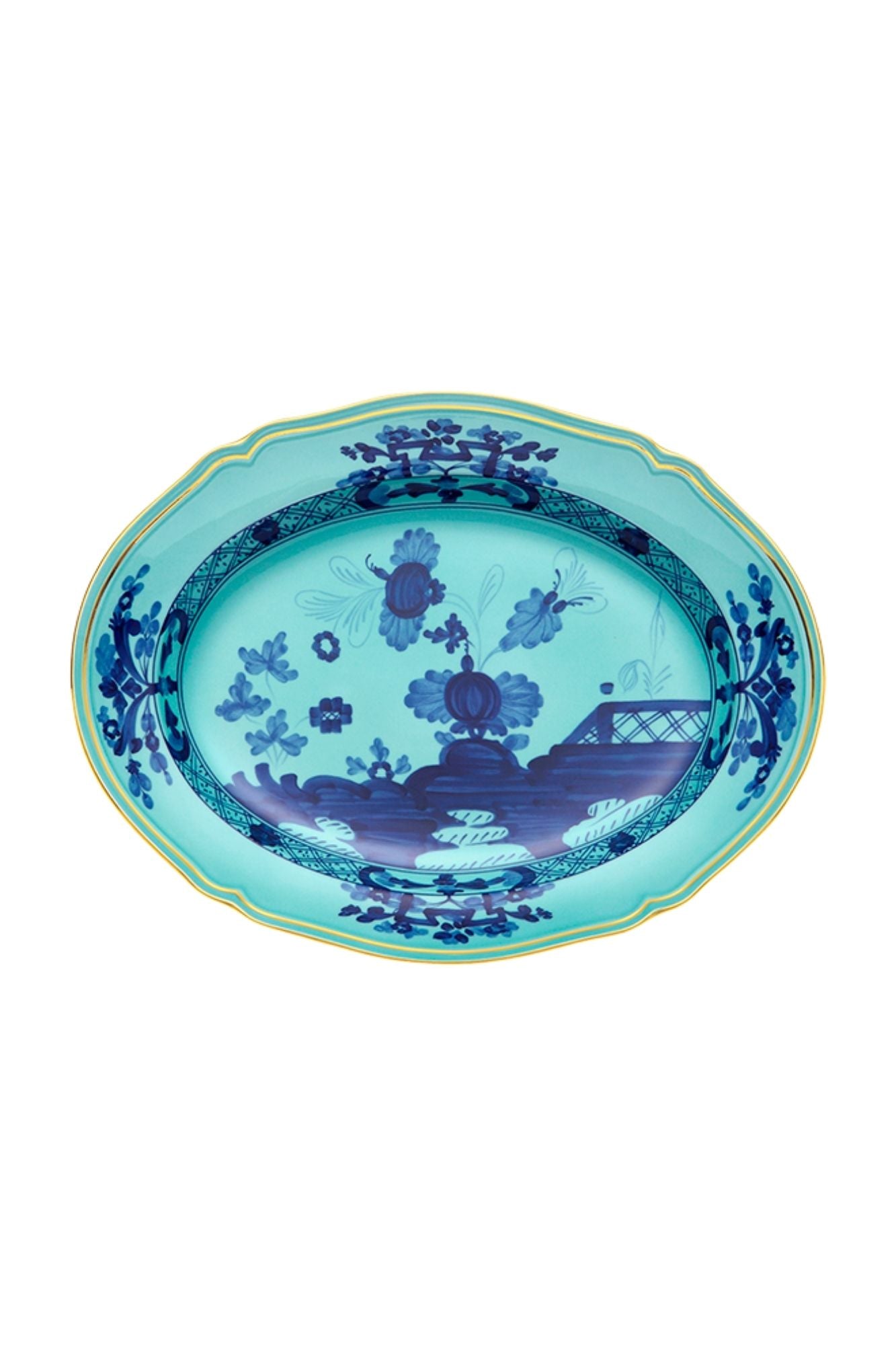 This turquoise and blue porcelain in Ginori’s traditional Antico Doccia shape is decorated with a stylized carnation reinterpreted by Gio Ponti in 1946. 24-karat yellow gold accents each piece.