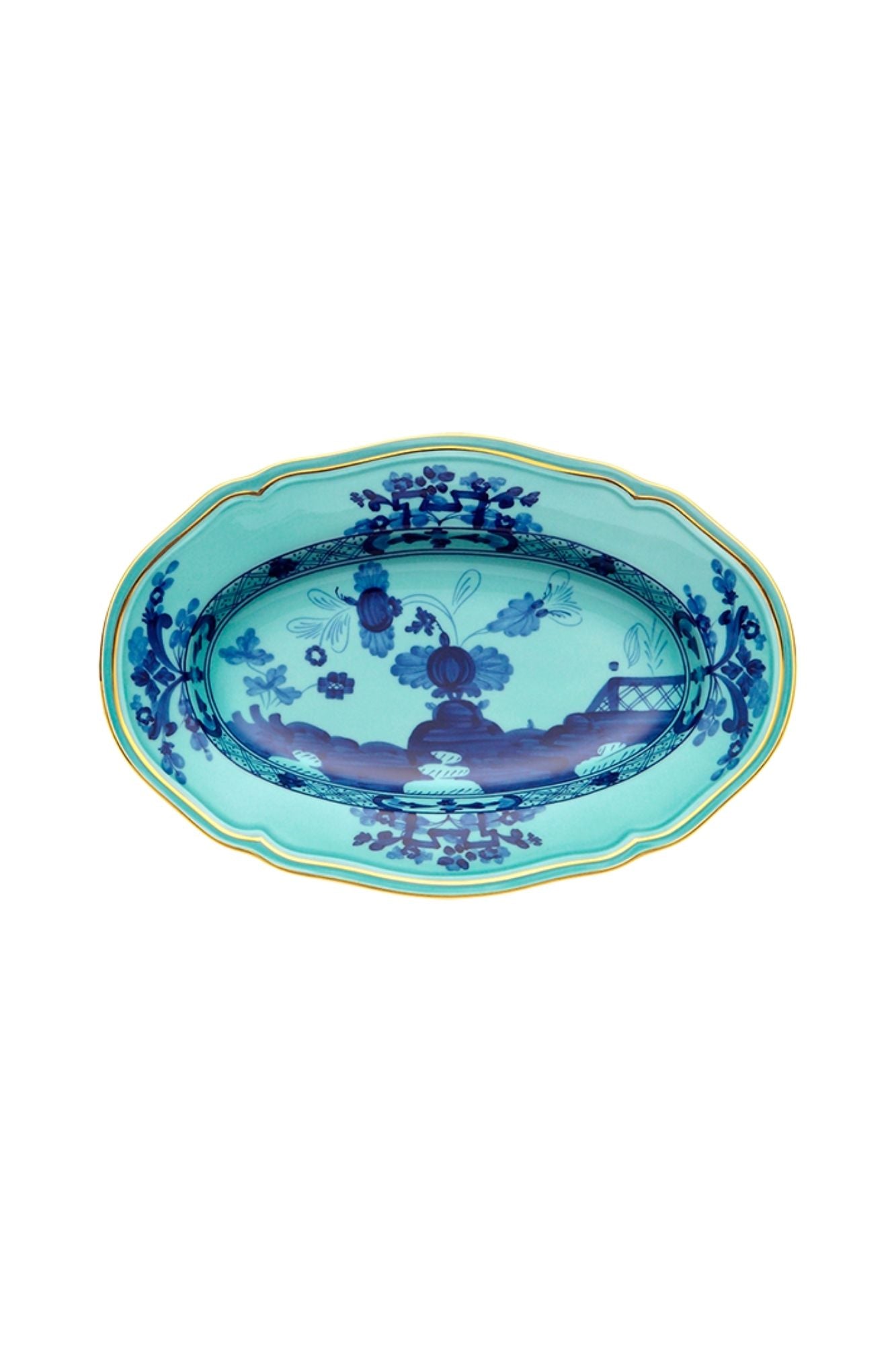 This turquoise and blue porcelain in Ginori’s traditional Antico Doccia shape is decorated with a stylized carnation reinterpreted by Gio Ponti in 1946. 24-karat yellow gold accents each piece.