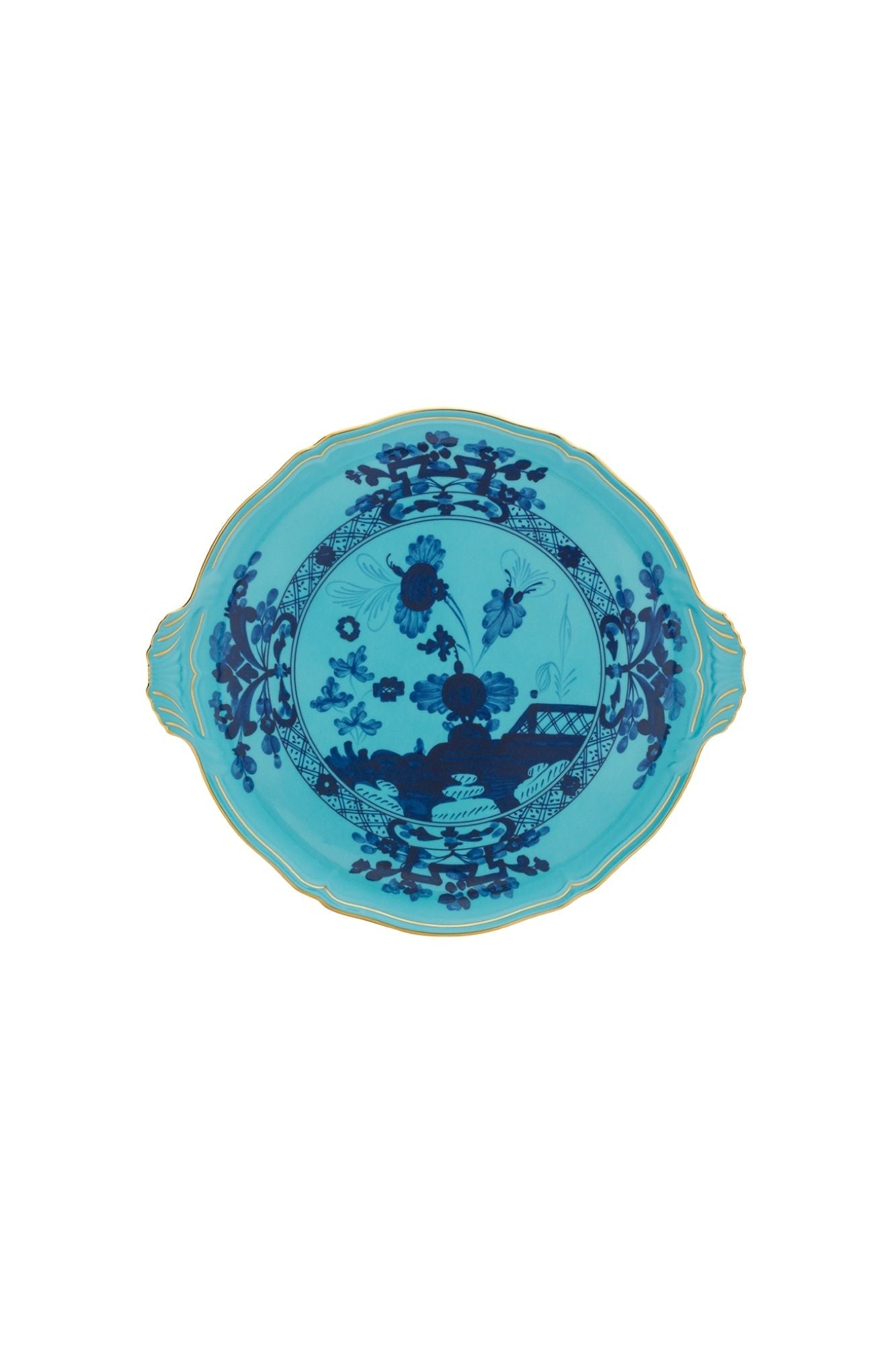 This turquoise and blue porcelain in Ginori’s traditional Antico Doccia shape is decorated with a stylized carnation reinterpreted by Gio Ponti in 1946. 24-karat yellow gold accents each piece.