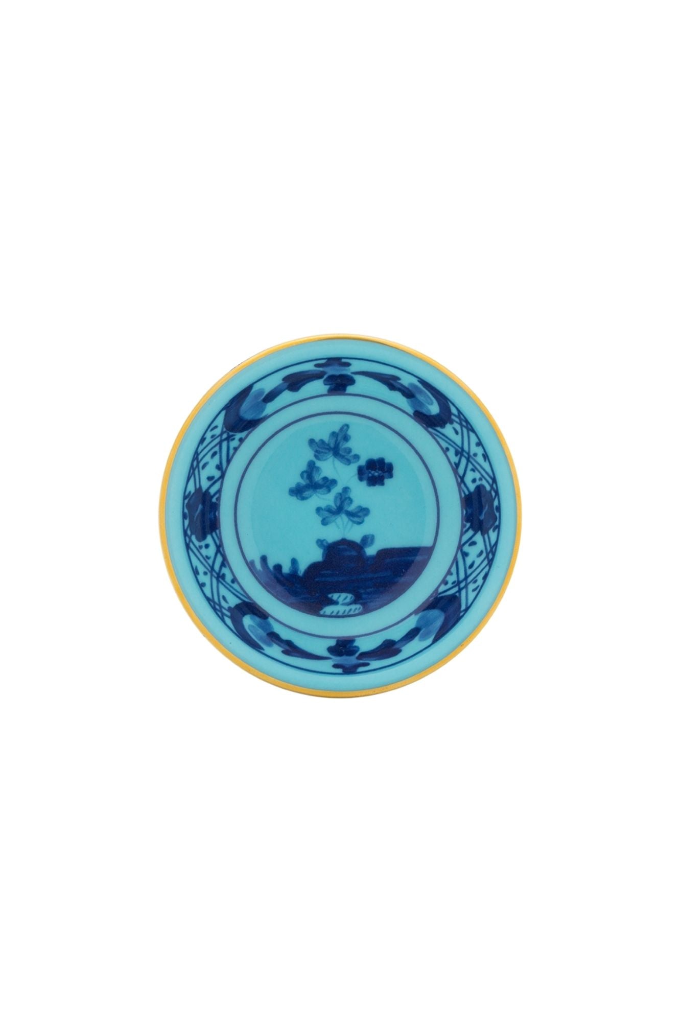This turquoise and blue porcelain in Ginori’s traditional Antico Doccia shape is decorated with a stylized carnation reinterpreted by Gio Ponti in 1946. 24-karat yellow gold accents each piece.