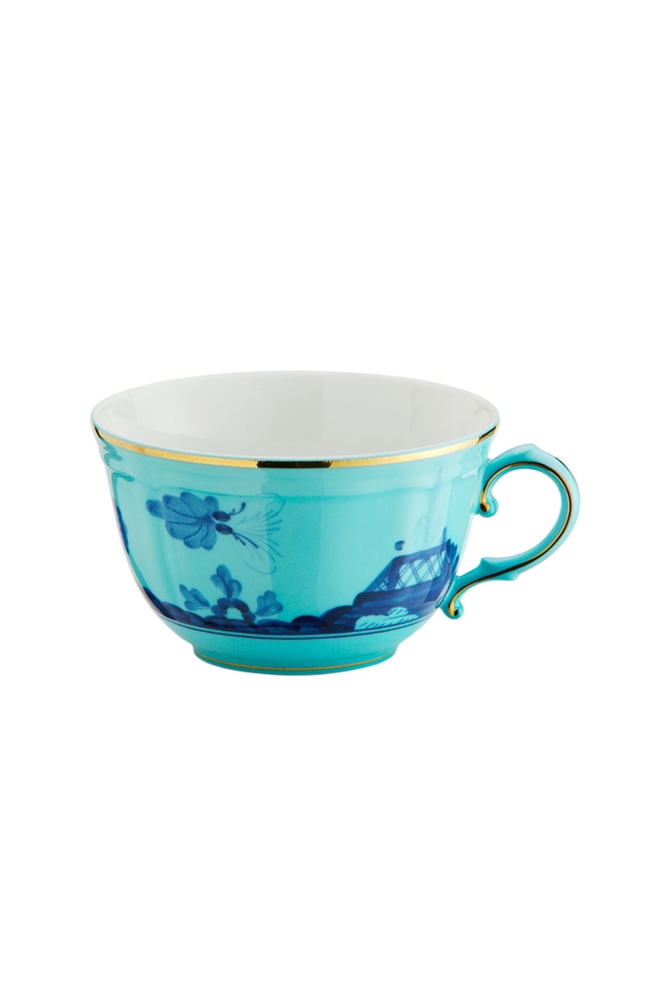 This turquoise and blue porcelain in Ginori’s traditional Antico Doccia shape is decorated with a stylized carnation reinterpreted by Gio Ponti in 1946. 24-karat yellow gold accents each piece.