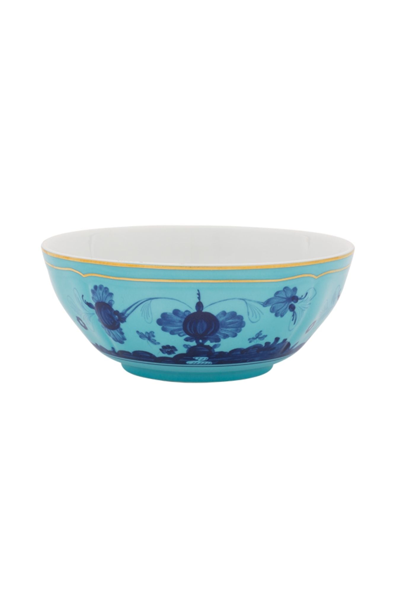 This turquoise and blue porcelain in Ginori’s traditional Antico Doccia shape is decorated with a stylized carnation reinterpreted by Gio Ponti in 1946. 24-karat yellow gold accents each piece.