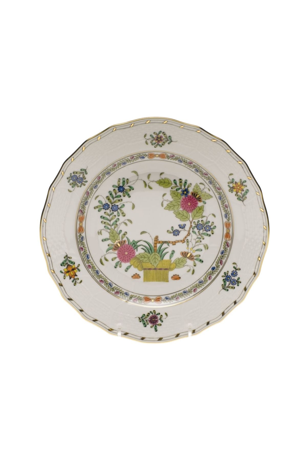 Porcelain dinnerware that has rich colors in an exotic pattern that stand alone with a solid cloth or add strong layers to a Bohemian look.