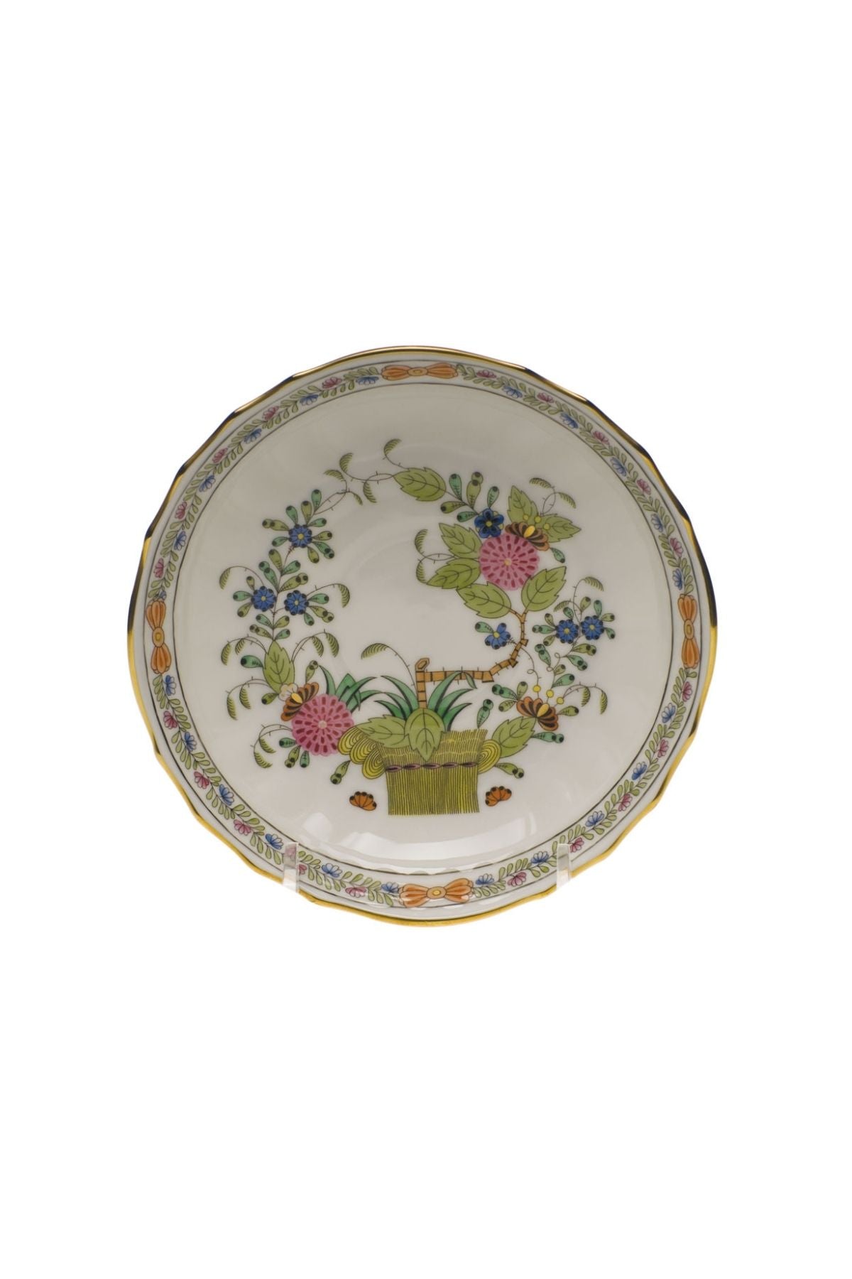 Porcelain dinnerware that has rich colors in an exotic pattern that stand alone with a solid cloth or add strong layers to a Bohemian look.