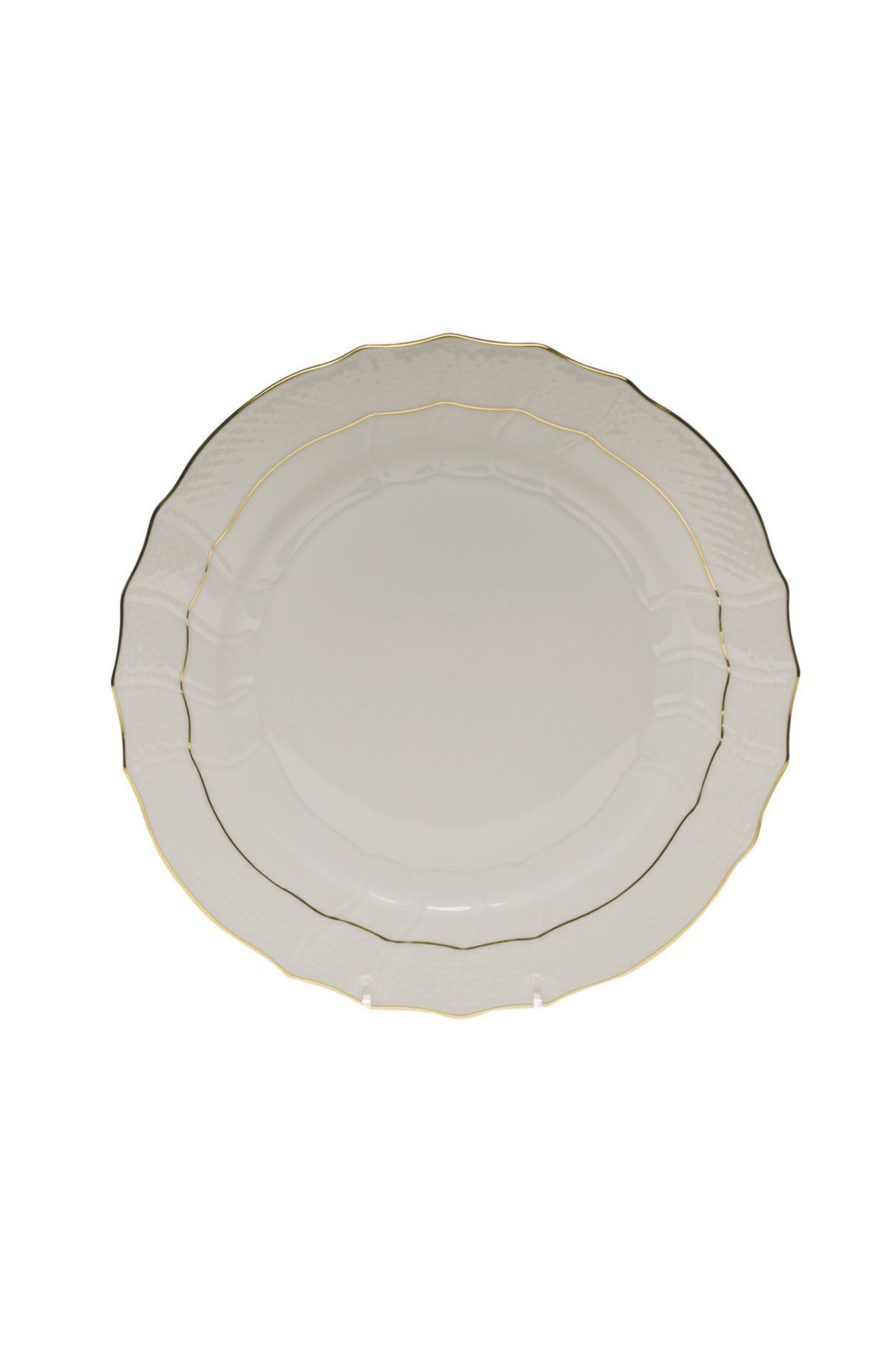 Dinnerware that is white with gold edge.