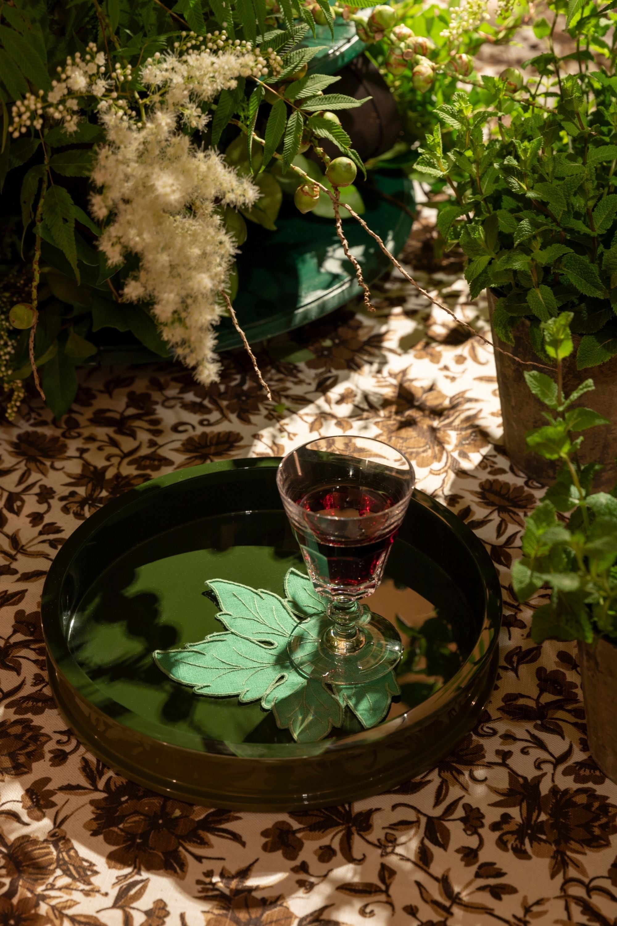 Circular olive lacquered serving tray.