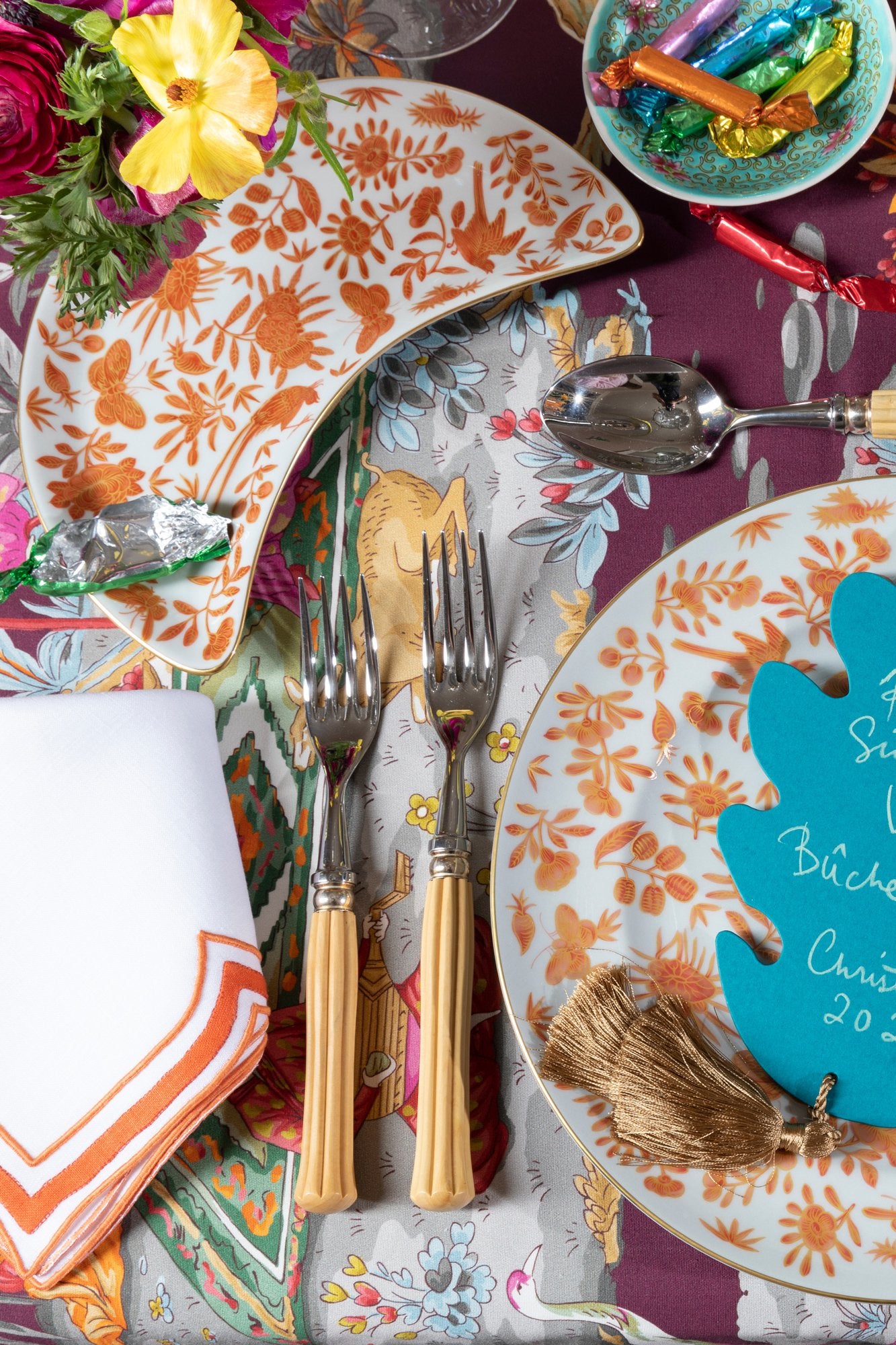Sacred birds in orange print. Five piece place setting includes dinner plate, dessert plate, bread & butter plate and teacup with saucer.