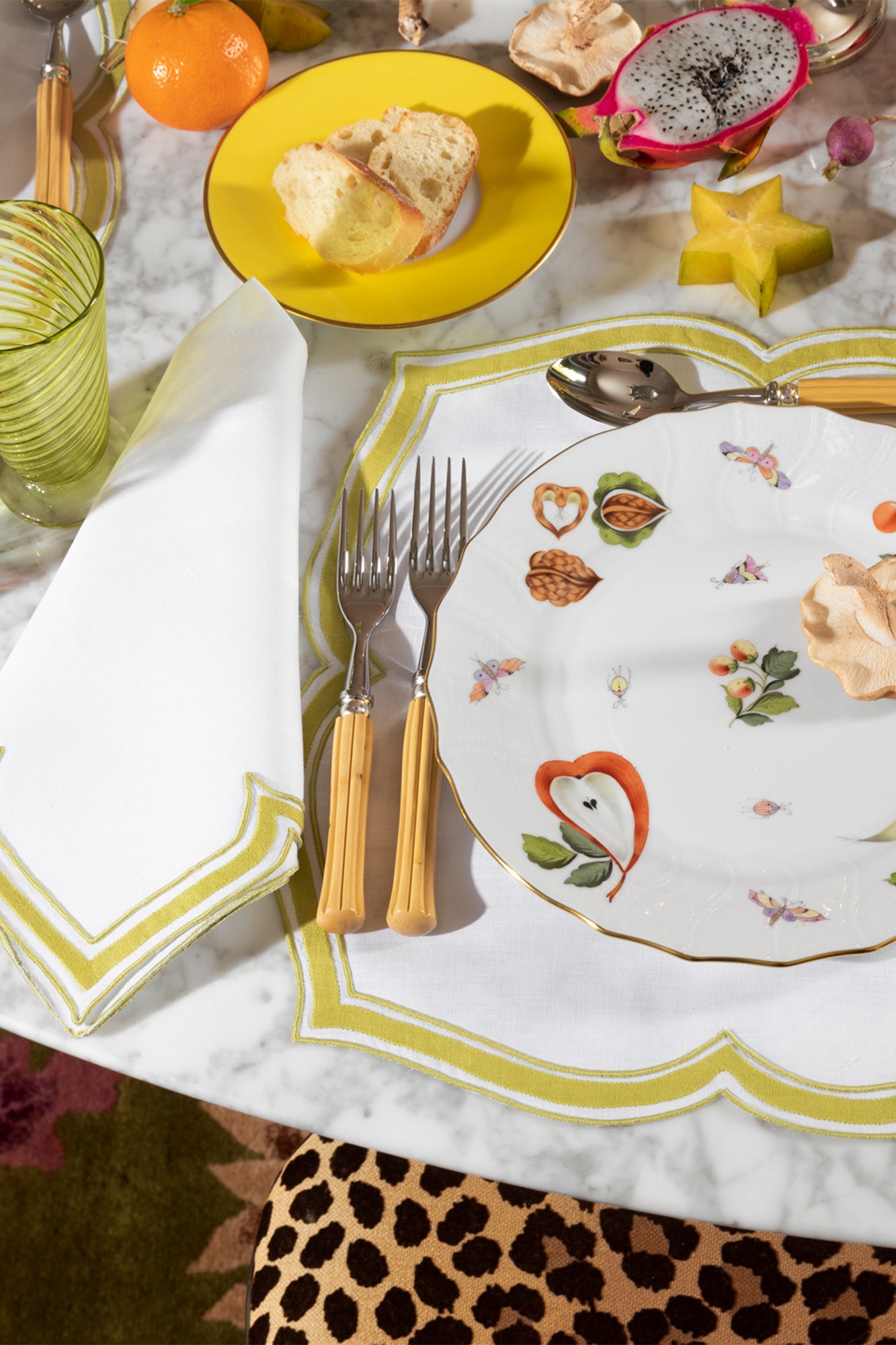 Market Garden designs on porcelain. Five piece place setting includes dinner plate, dessert plate, bread & butter plate and tea cup with saucer.