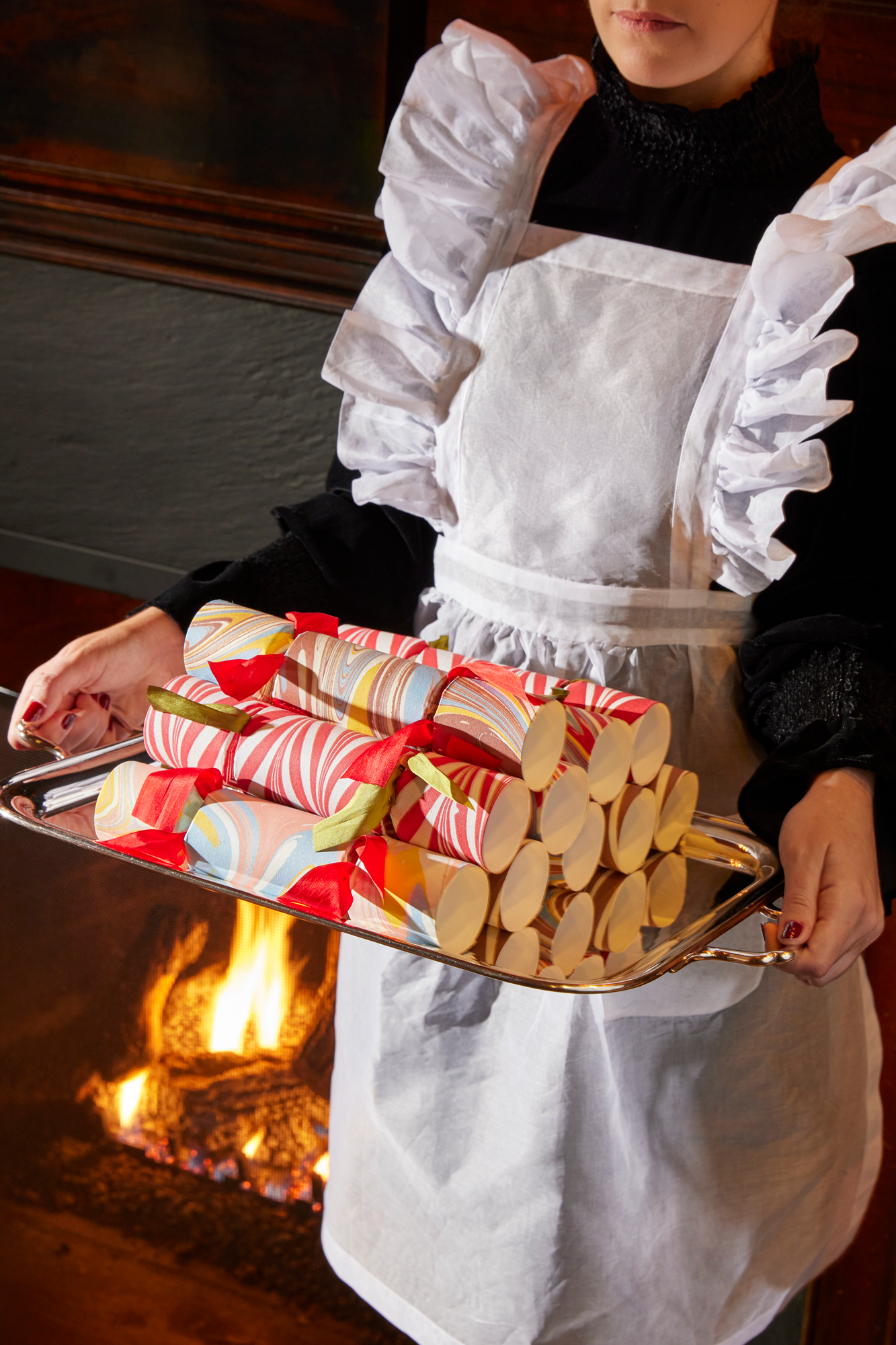 Charming ruffled aprons in white cotton organdy.