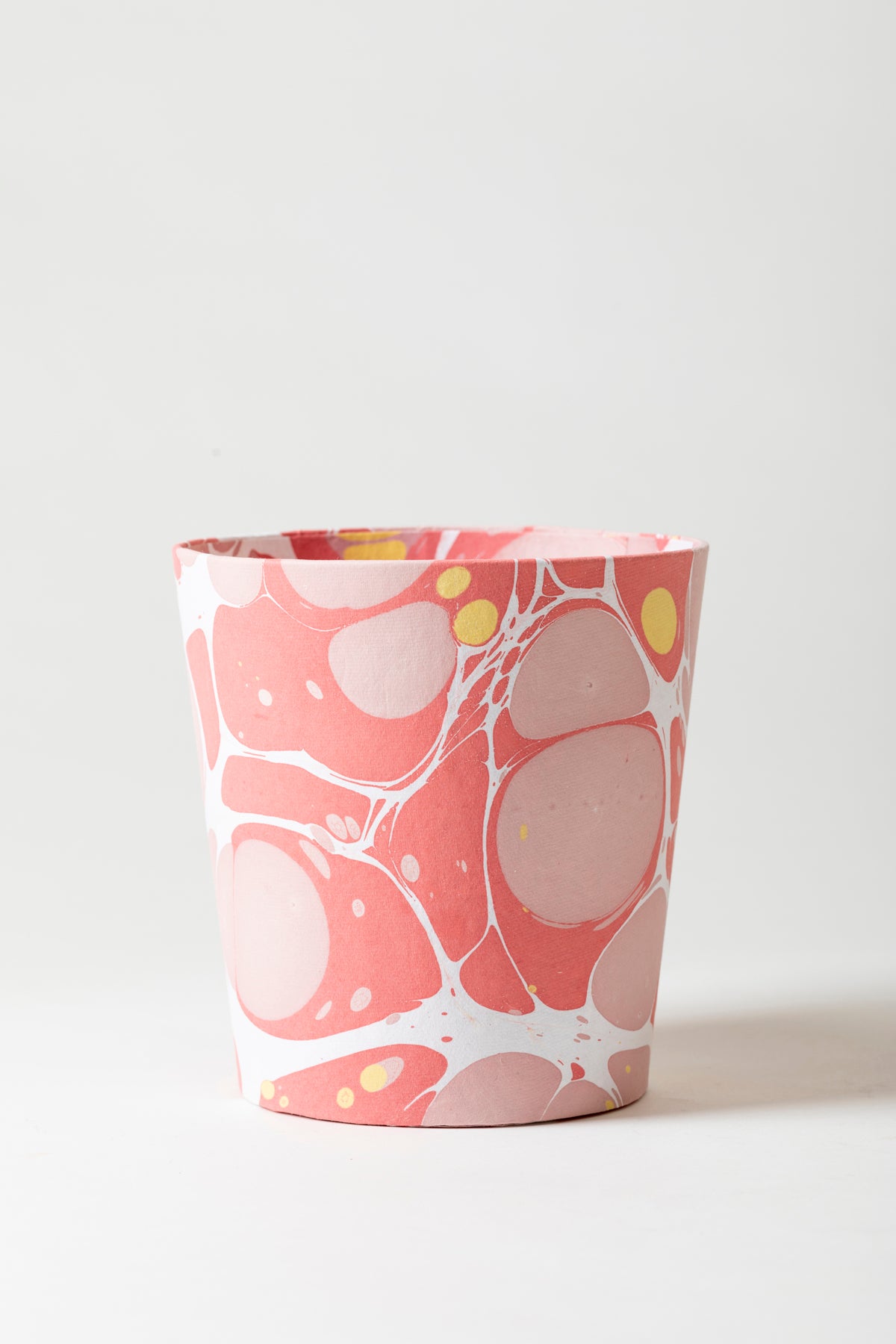 Artisan paper-covered cachepots with a plastic liner. Made to fit pots of standard seasonal bulbs or orchids.