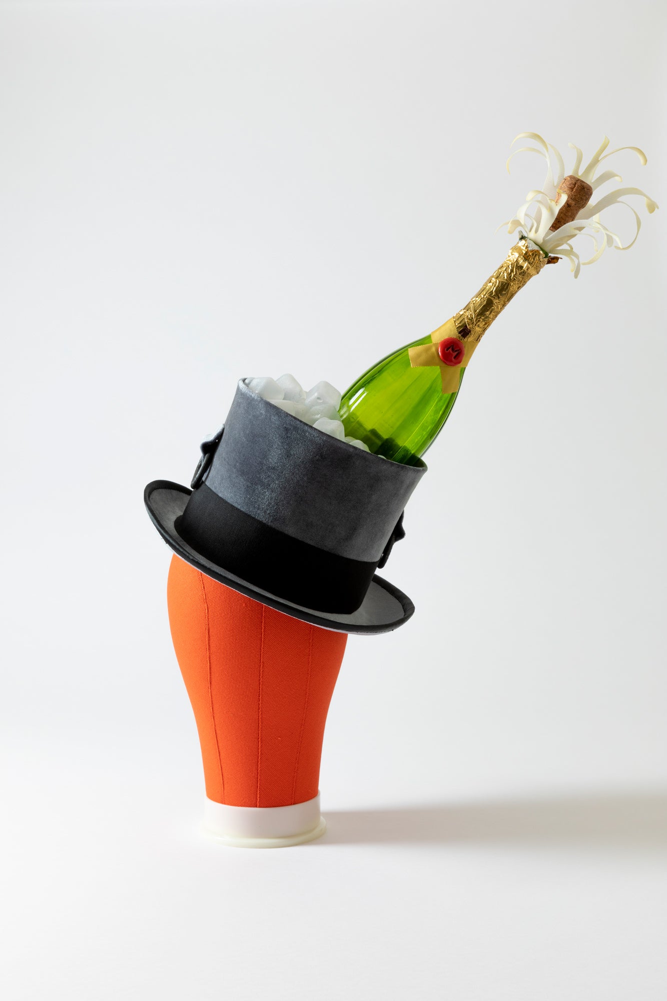 This velvet top hat and has a Champagne bottle with ice cubes. Incredible details like silk bonded champagne sprays and wax seals are works of art. Handmade by a milliner Tel Aviv.