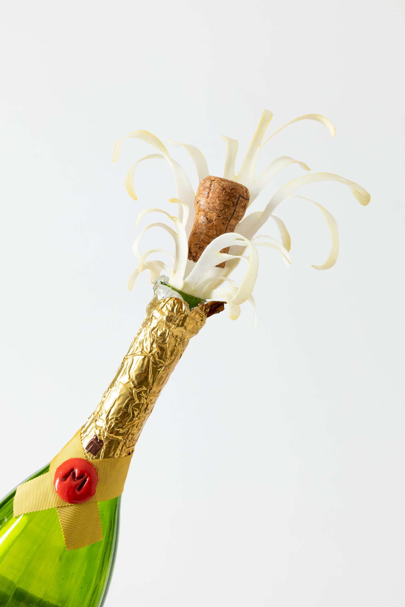 This velvet top hat and has a Champagne bottle with ice cubes. Incredible details like silk bonded champagne sprays and wax seals are works of art. Handmade by a milliner Tel Aviv.