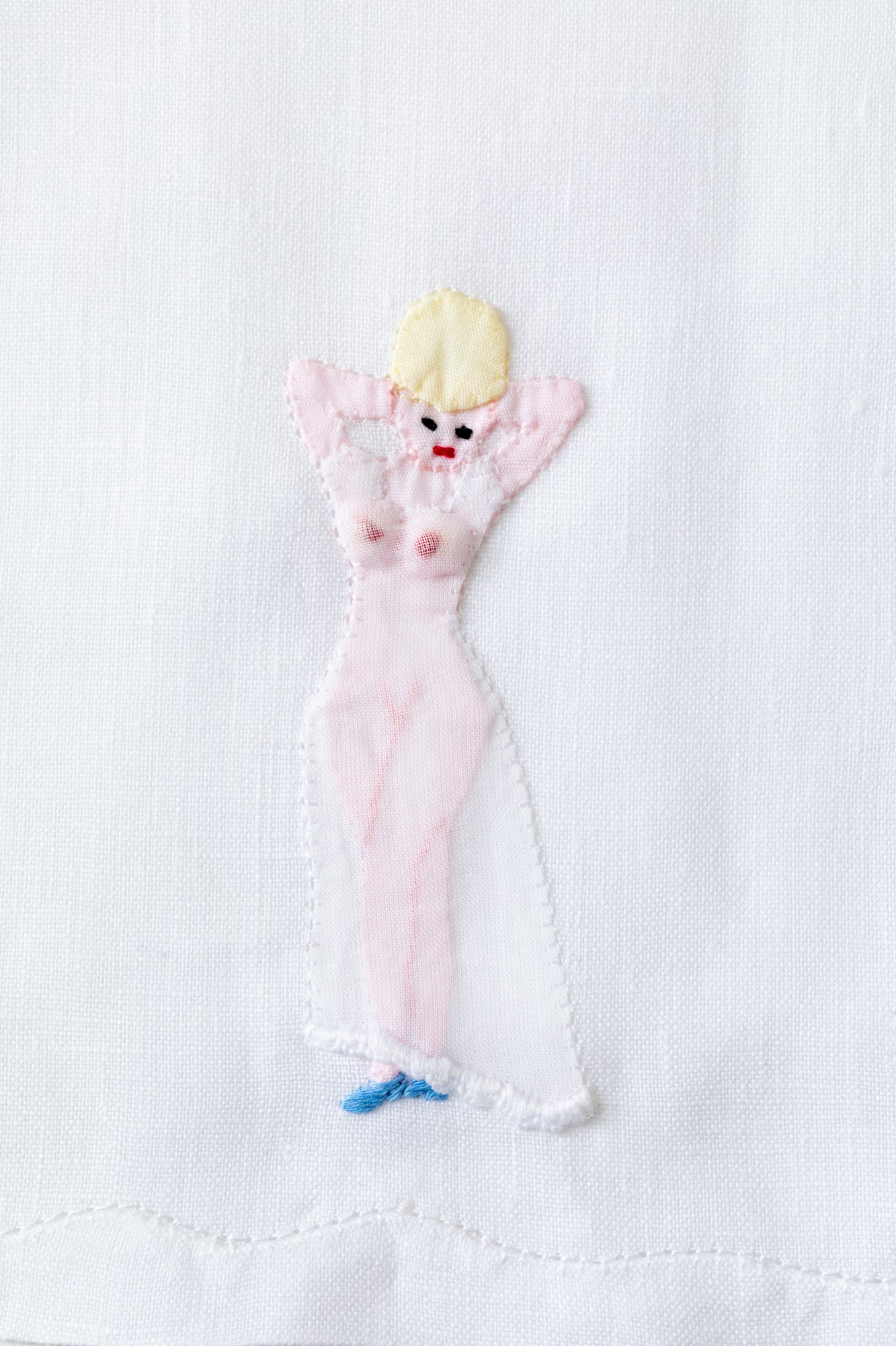 Embroidered cocktail napkins with scandalous women.