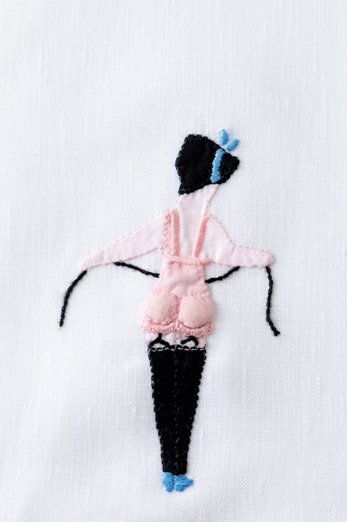 Embroidered cocktail napkins with scandalous women.