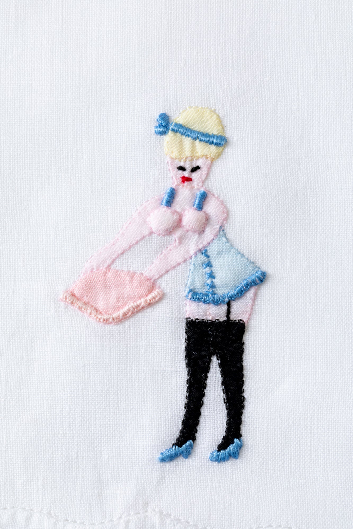 Embroidered cocktail napkins with scandalous women.