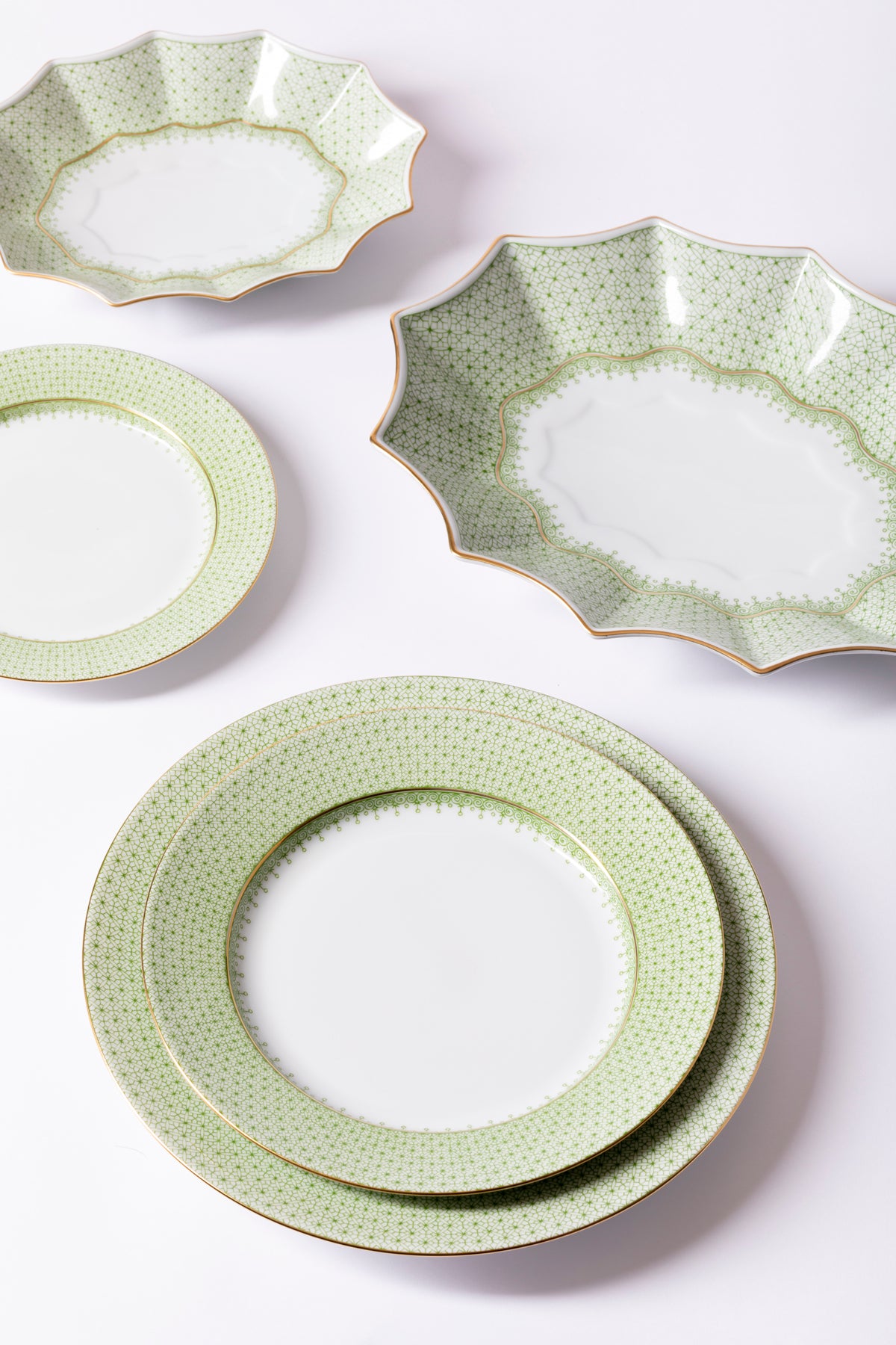 Dinner set with original cobalt based Blue Lace teardrop apple green border.