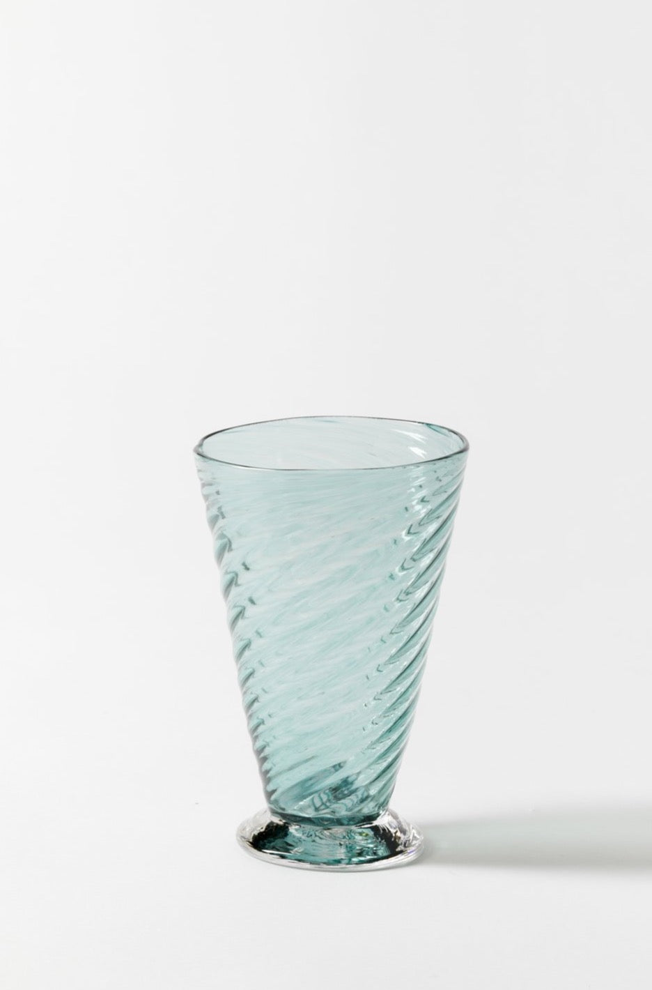 Hand-blown exclusively for Houses & Parties using twisted glass canes.