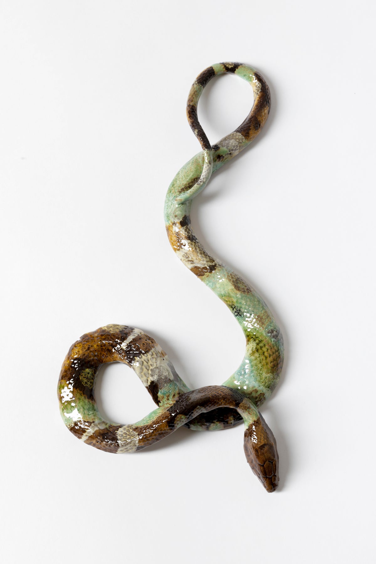 Ceramic snake glazed with brown, blue, and green.